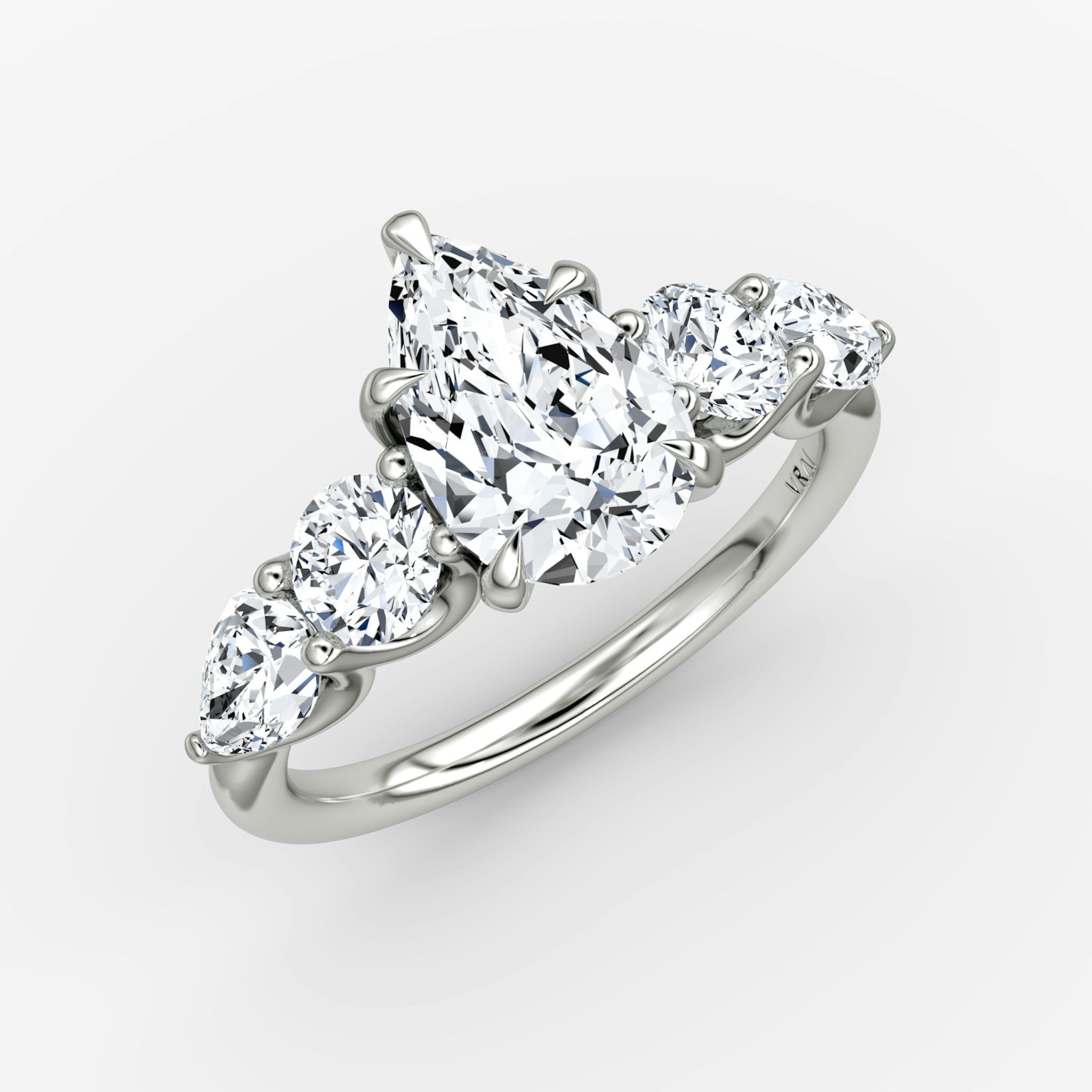 The Mixed Shape | Pear | 18k | White Gold | bandAccent: Plain | sideStoneOrientation: horizontal | sideStoneShape: Round Brilliant and Pear | diamondOrientation: vertical | caratWeight: other