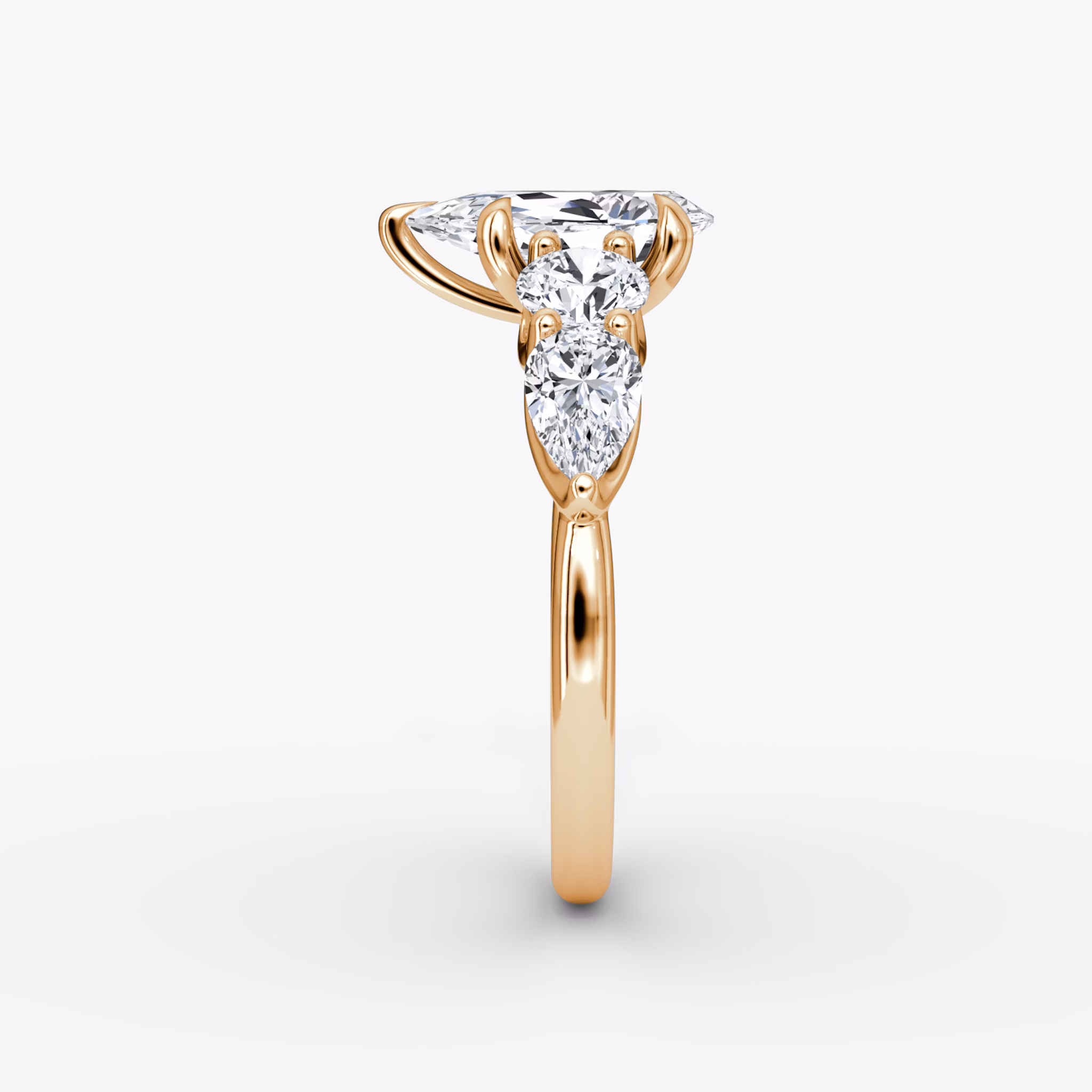 The Mixed Shape | Pear | 14k | Rose Gold | bandAccent: Plain | sideStoneOrientation: horizontal | sideStoneShape: Round Brilliant and Pear | diamondOrientation: vertical | caratWeight: other