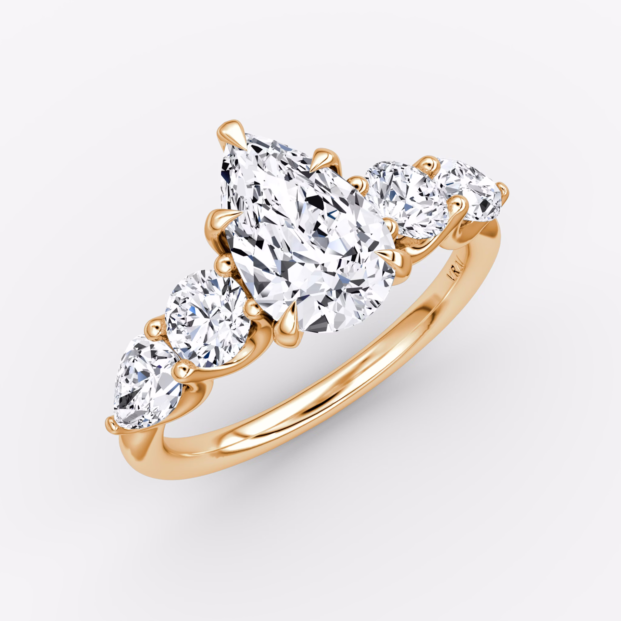 The Mixed Shape | Pear | 14k | Rose Gold | bandAccent: Plain | sideStoneOrientation: horizontal | sideStoneShape: Round Brilliant and Pear | diamondOrientation: vertical | caratWeight: other