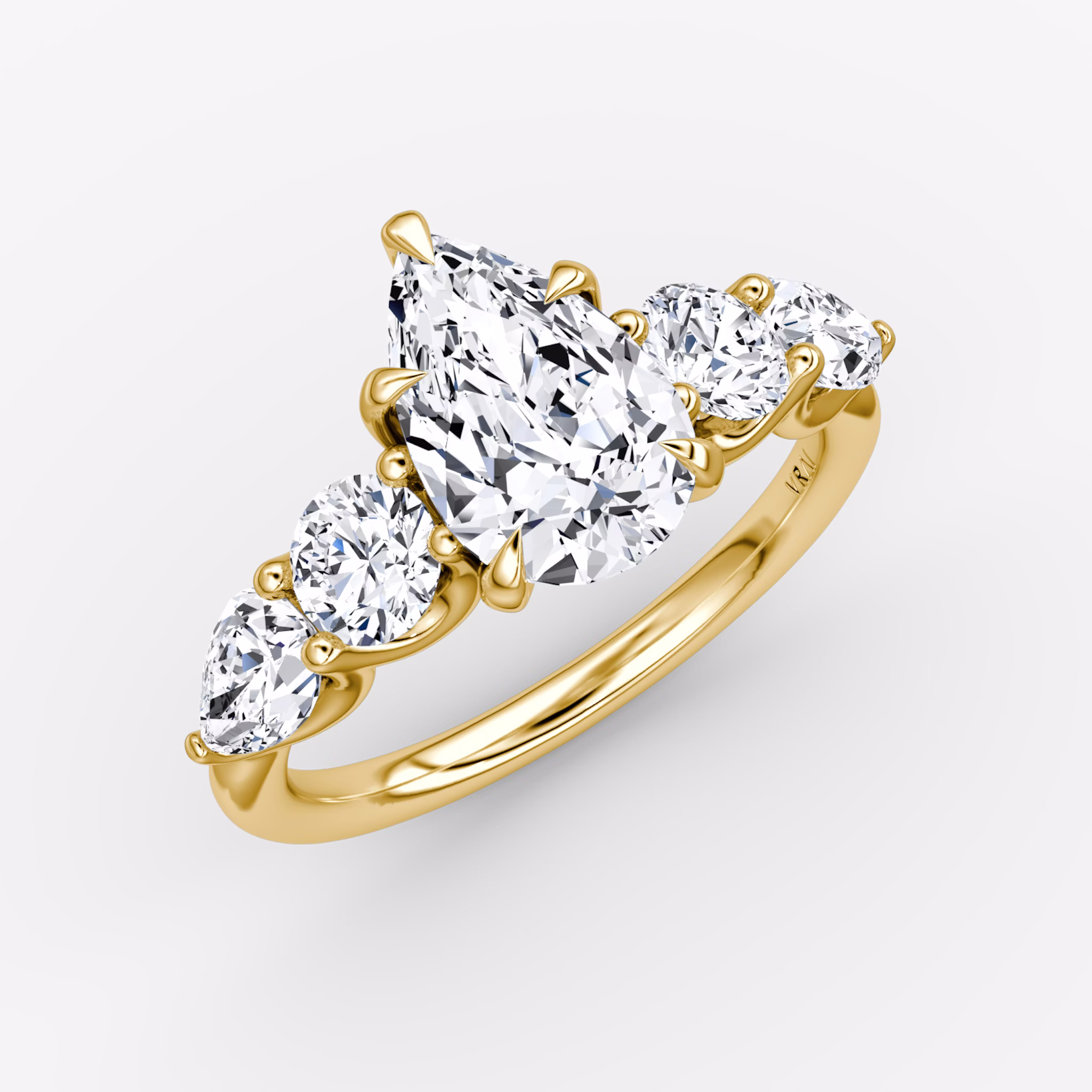 The Mixed Shape | Pear | 18k | Yellow Gold | bandAccent: Plain | sideStoneOrientation: horizontal | sideStoneShape: Round Brilliant and Pear | diamondOrientation: vertical | caratWeight: other