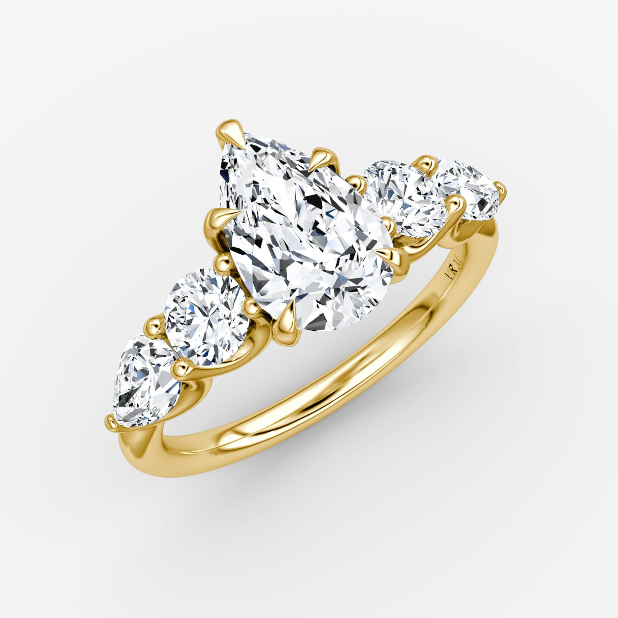 The Mixed Shape | Pear | 18k | Yellow Gold | bandAccent: Plain | sideStoneOrientation: horizontal | sideStoneShape: Round Brilliant and Pear | diamondOrientation: vertical | caratWeight: other