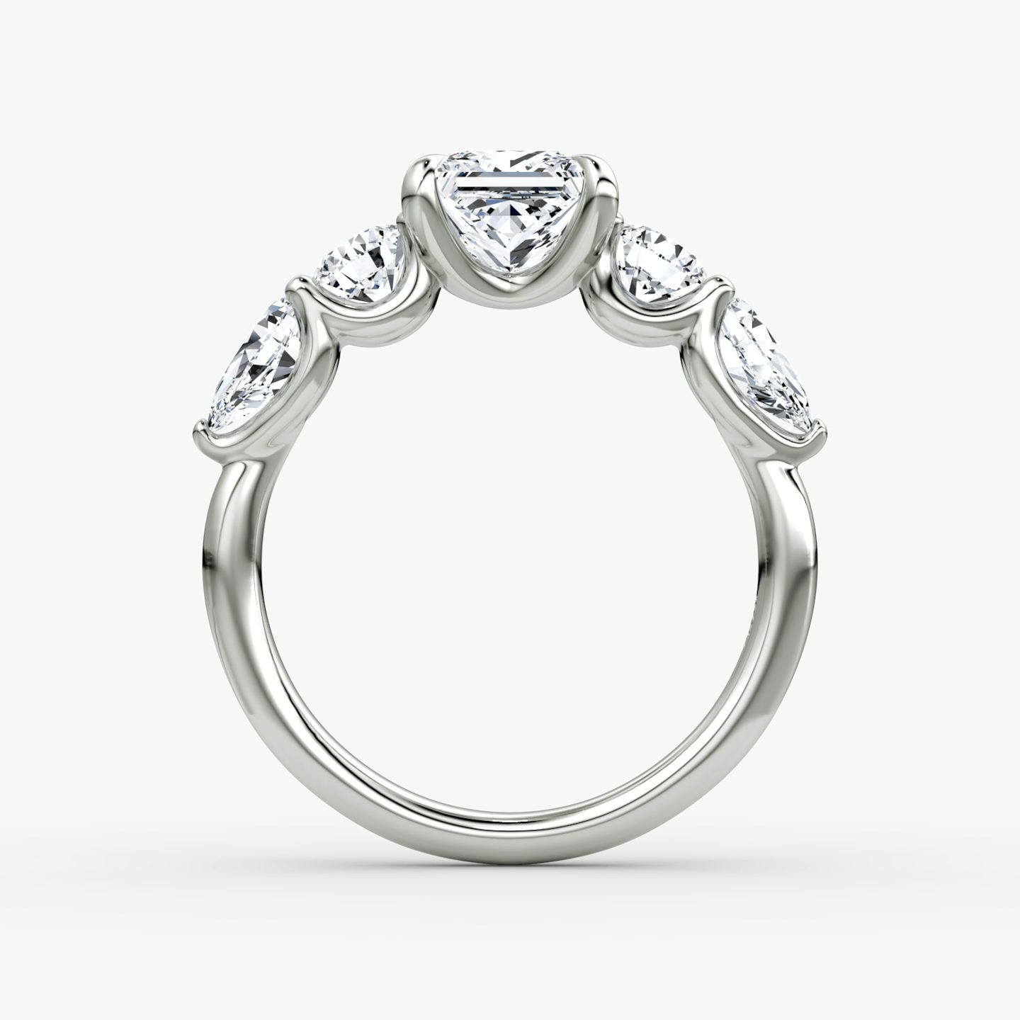The Mixed Shape | Princess | Platinum | bandAccent: Plain | sideStoneOrientation: horizontal | sideStoneShape: Round Brilliant and Pear | diamondOrientation: vertical | caratWeight: other