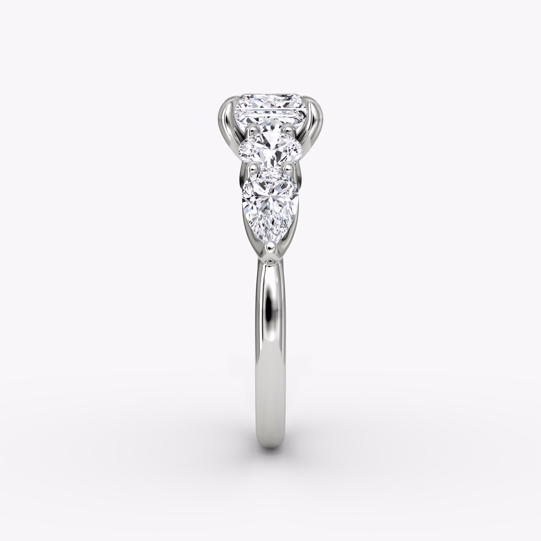 The Mixed Shape | Princess | 18k | White Gold | bandAccent: Plain | sideStoneOrientation: horizontal | sideStoneShape: Round Brilliant and Pear | diamondOrientation: vertical | caratWeight: other