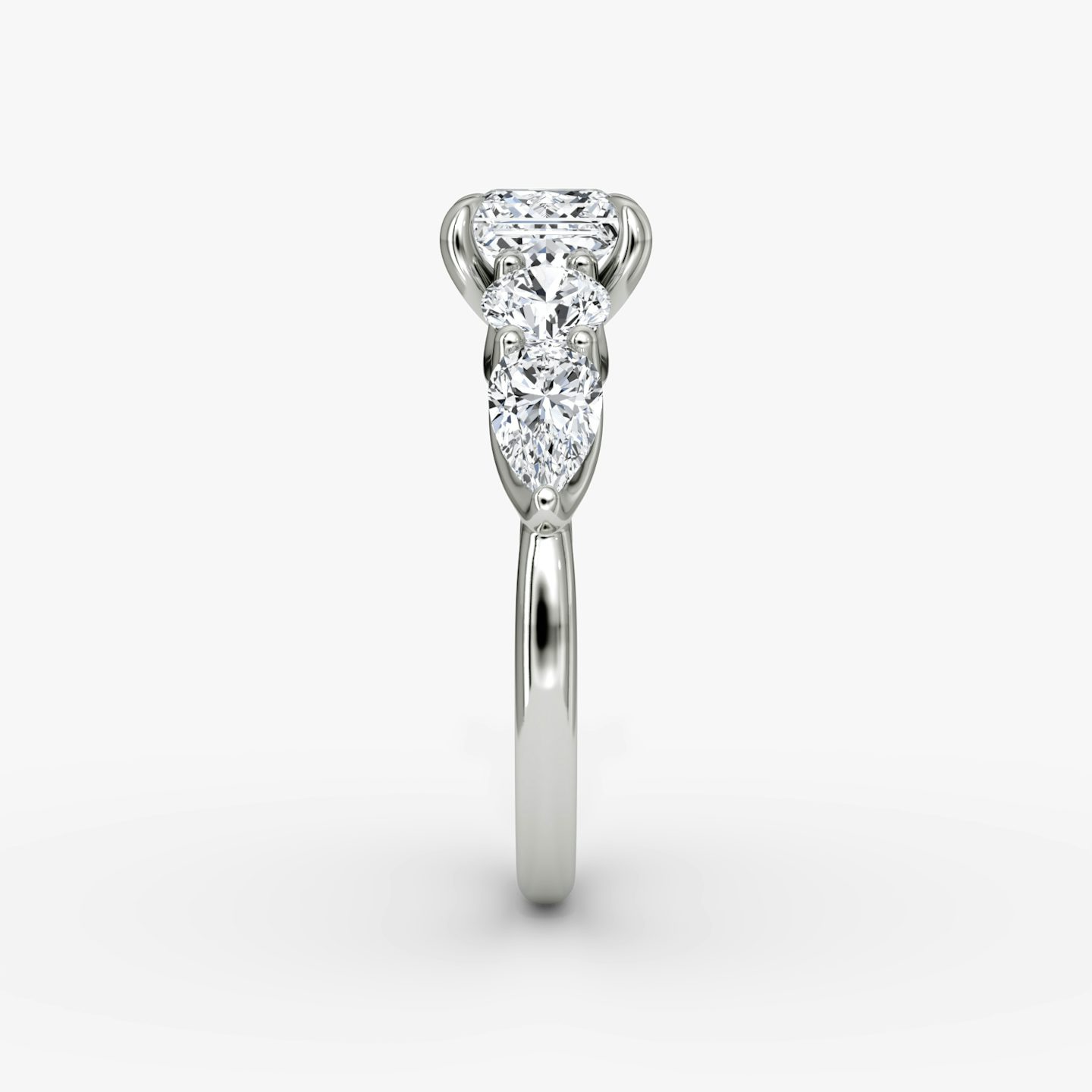 The Mixed Shape | Princess | Platinum | bandAccent: Plain | sideStoneOrientation: horizontal | sideStoneShape: Round Brilliant and Pear | diamondOrientation: vertical | caratWeight: other