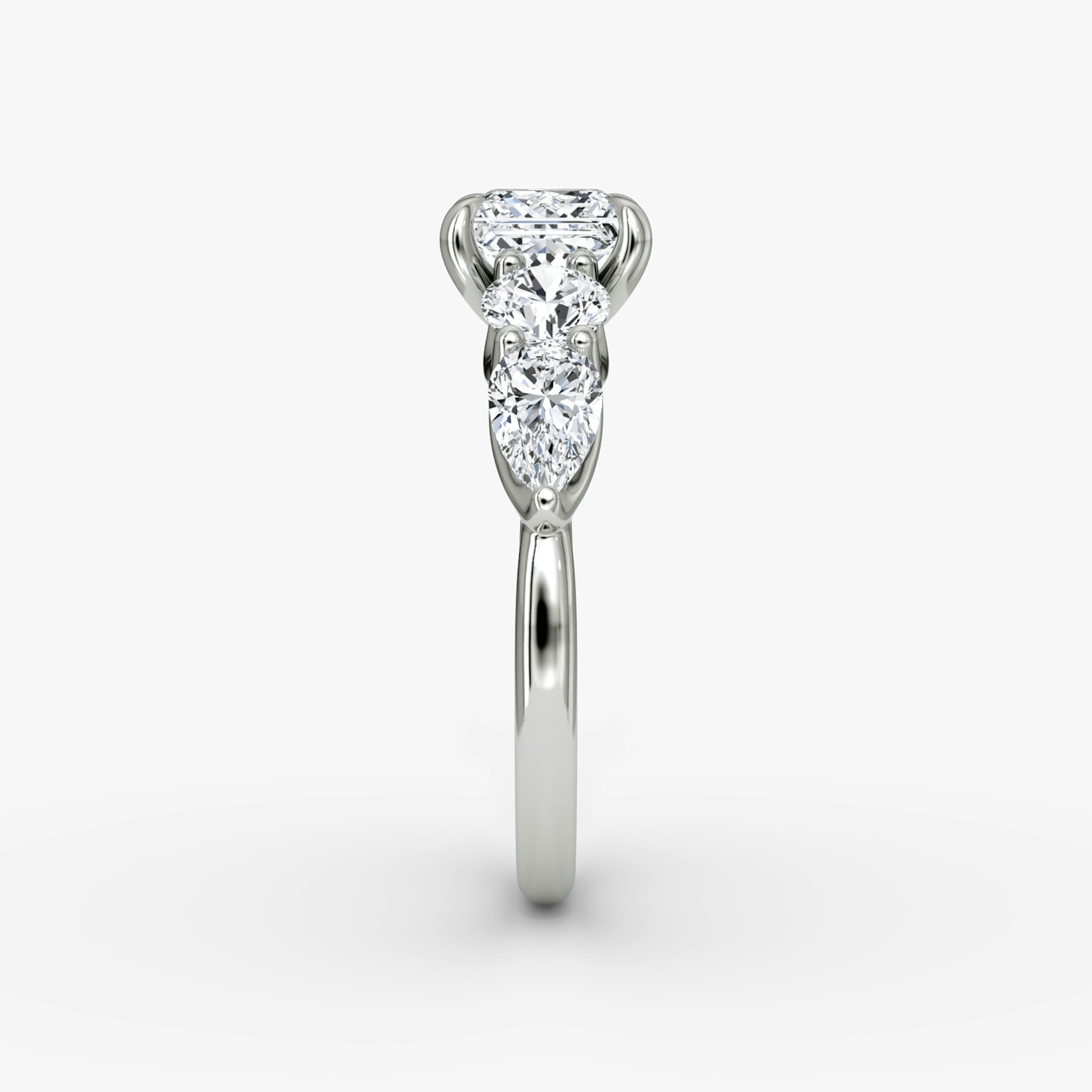 The Mixed Shape | Princess | 18k | White Gold | bandAccent: Plain | sideStoneOrientation: horizontal | sideStoneShape: Round Brilliant and Pear | diamondOrientation: vertical | caratWeight: other