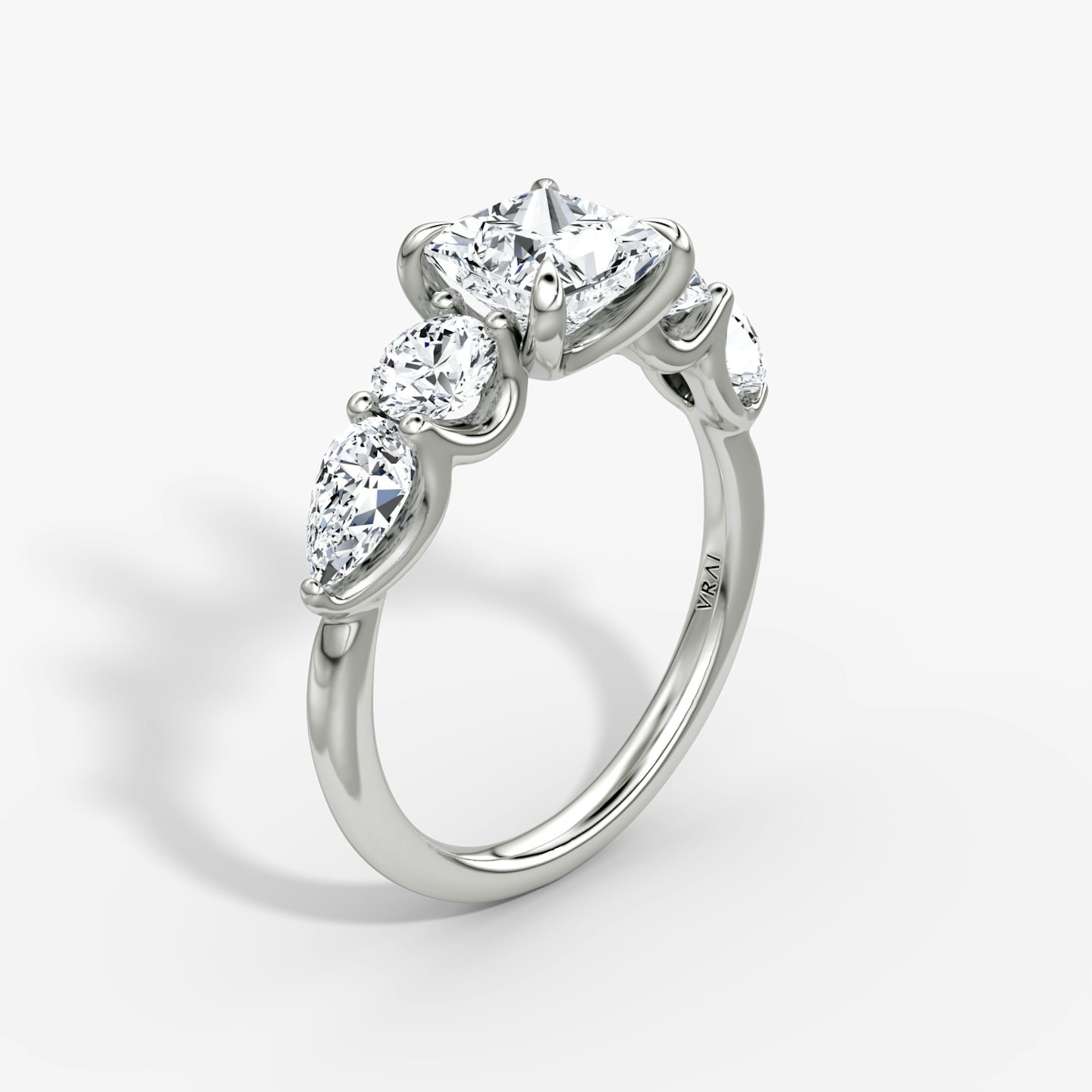 The Mixed Shape | Princess | Platinum | bandAccent: Plain | sideStoneOrientation: horizontal | sideStoneShape: Round Brilliant and Pear | diamondOrientation: vertical | caratWeight: other