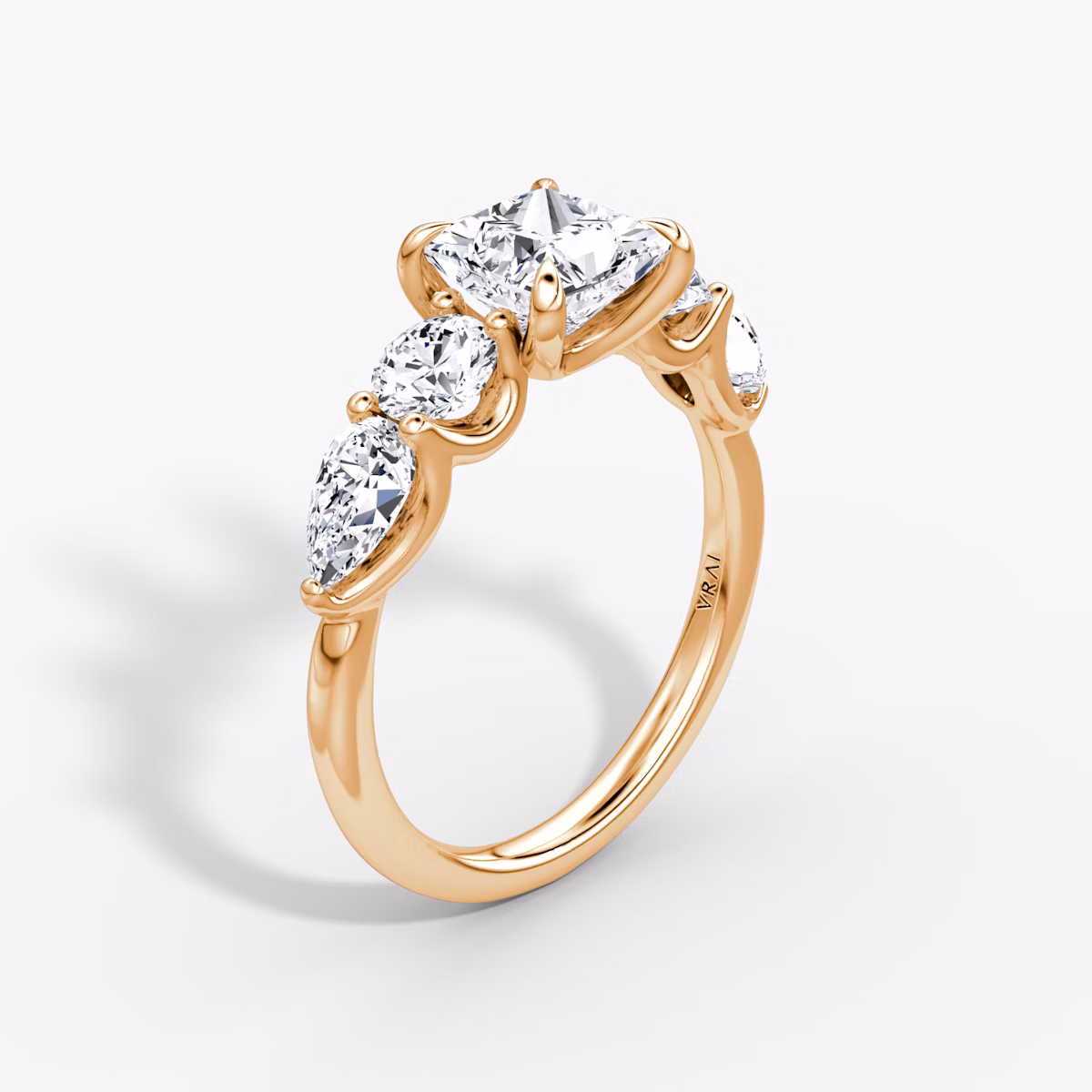 The Mixed Shape | Princess | 14k | Rose Gold | bandAccent: Plain | sideStoneOrientation: horizontal | sideStoneShape: Round Brilliant and Pear | diamondOrientation: vertical | caratWeight: other