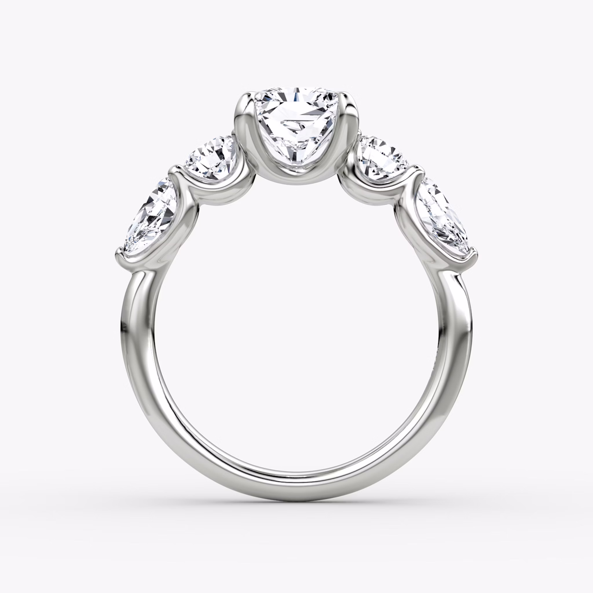 The Mixed Shape | Radiant | 18k | White Gold | bandAccent: Plain | sideStoneOrientation: horizontal | sideStoneShape: Round Brilliant and Pear | diamondOrientation: vertical | caratWeight: other