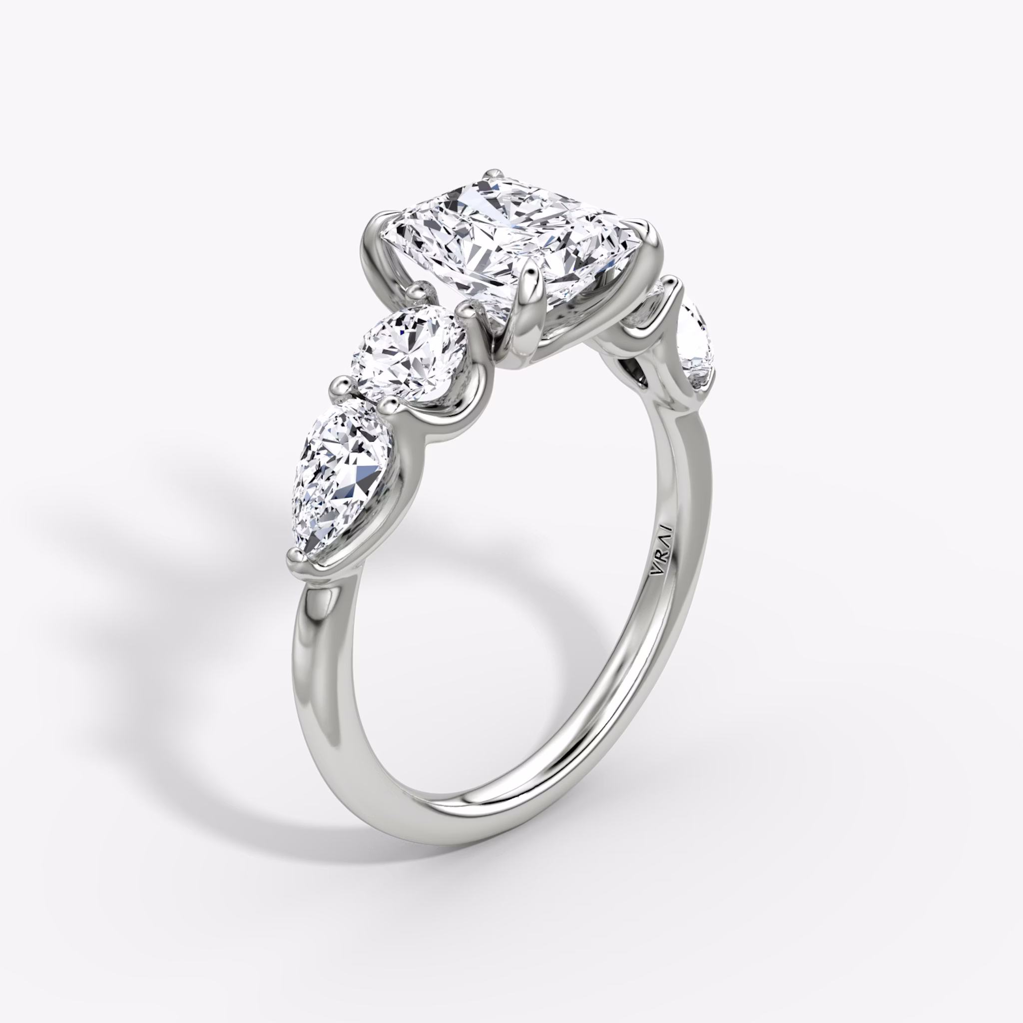 The Mixed Shape | Radiant | 18k | White Gold | bandAccent: Plain | sideStoneOrientation: horizontal | sideStoneShape: Round Brilliant and Pear | diamondOrientation: vertical | caratWeight: other