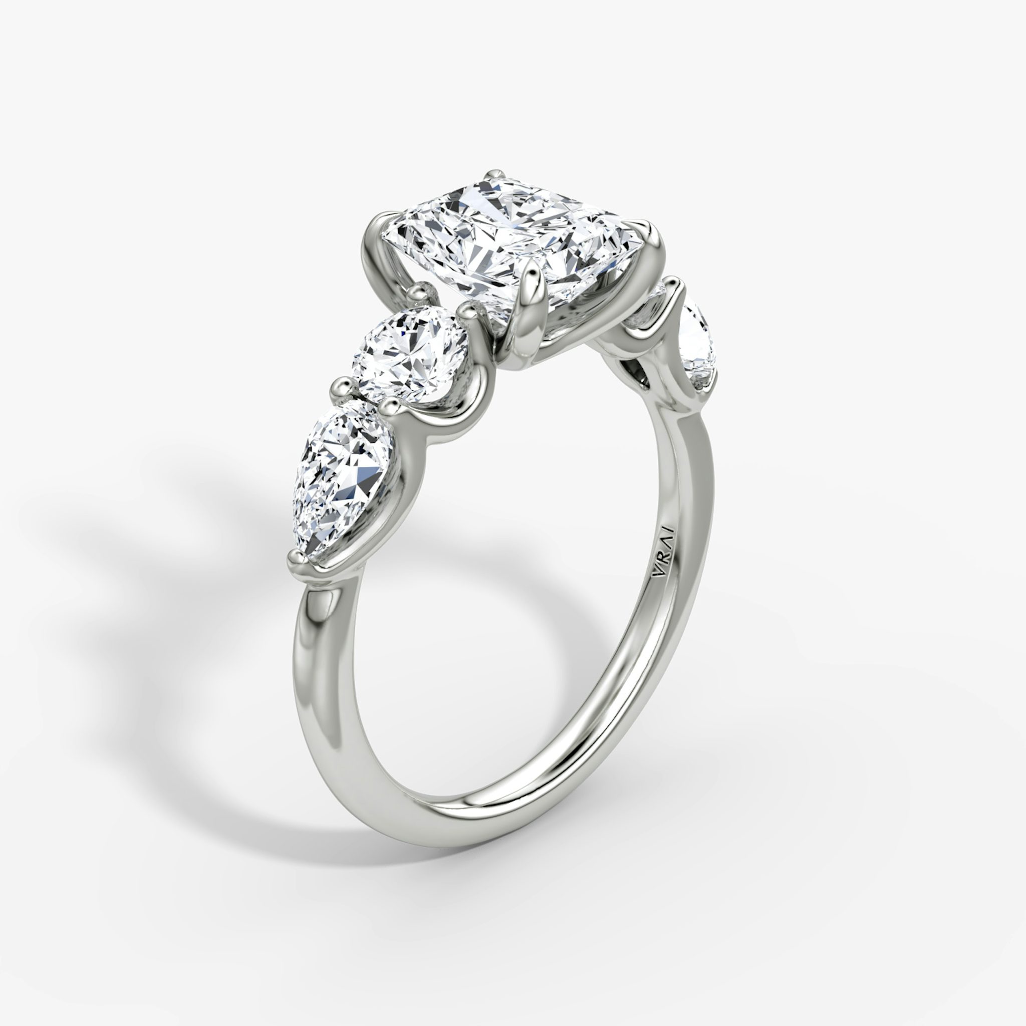 The Mixed Shape | Radiant | 18k | White Gold | bandAccent: Plain | sideStoneOrientation: horizontal | sideStoneShape: Round Brilliant and Pear | diamondOrientation: vertical | caratWeight: other