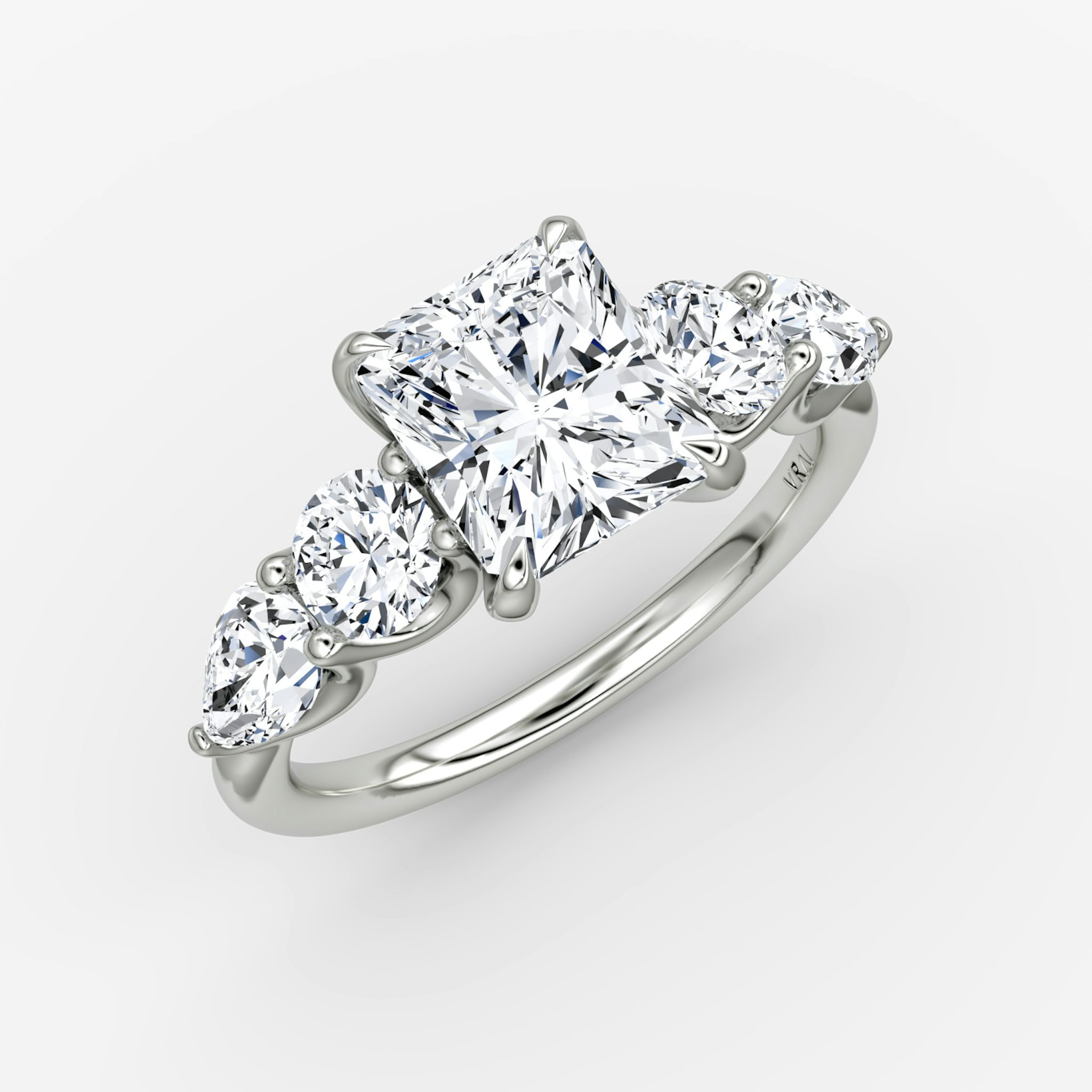 The Mixed Shape | Radiant | 18k | White Gold | bandAccent: Plain | sideStoneOrientation: horizontal | sideStoneShape: Round Brilliant and Pear | diamondOrientation: vertical | caratWeight: other