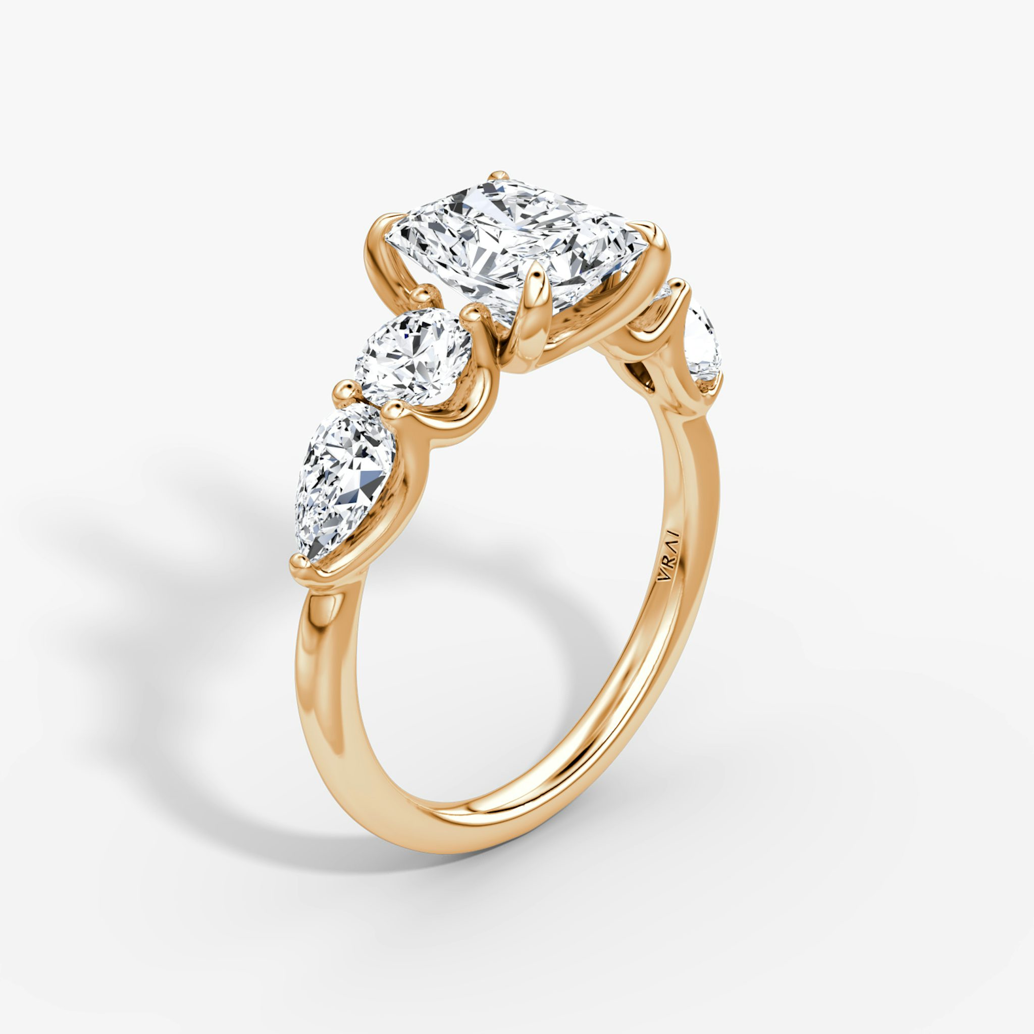 The Mixed Shape | Radiant | 14k | Rose Gold | bandAccent: Plain | sideStoneOrientation: horizontal | sideStoneShape: Round Brilliant and Pear | diamondOrientation: vertical | caratWeight: other