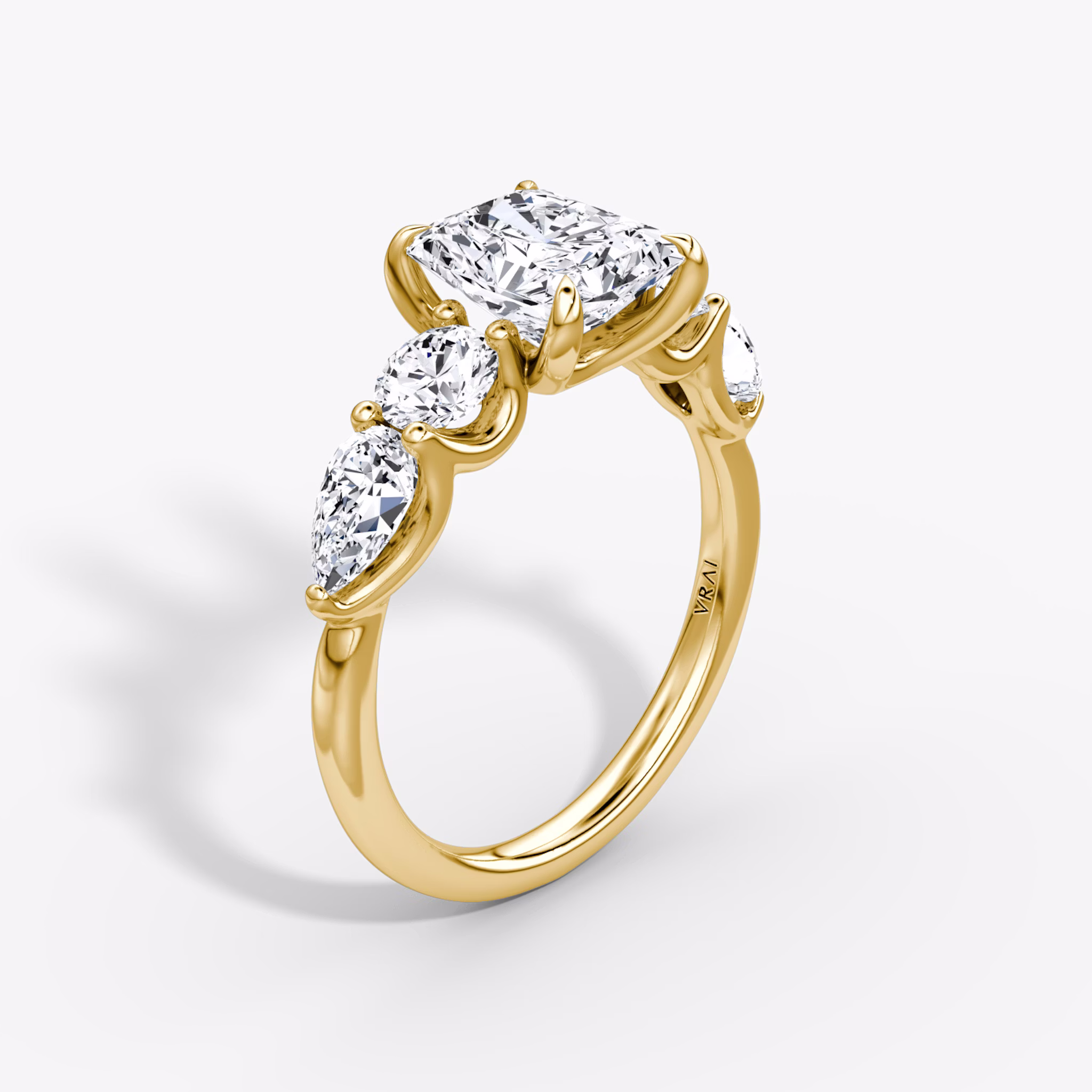 The Mixed Shape | Radiant | 18k | Yellow Gold | bandAccent: Plain | sideStoneOrientation: horizontal | sideStoneShape: Round Brilliant and Pear | diamondOrientation: vertical | caratWeight: other