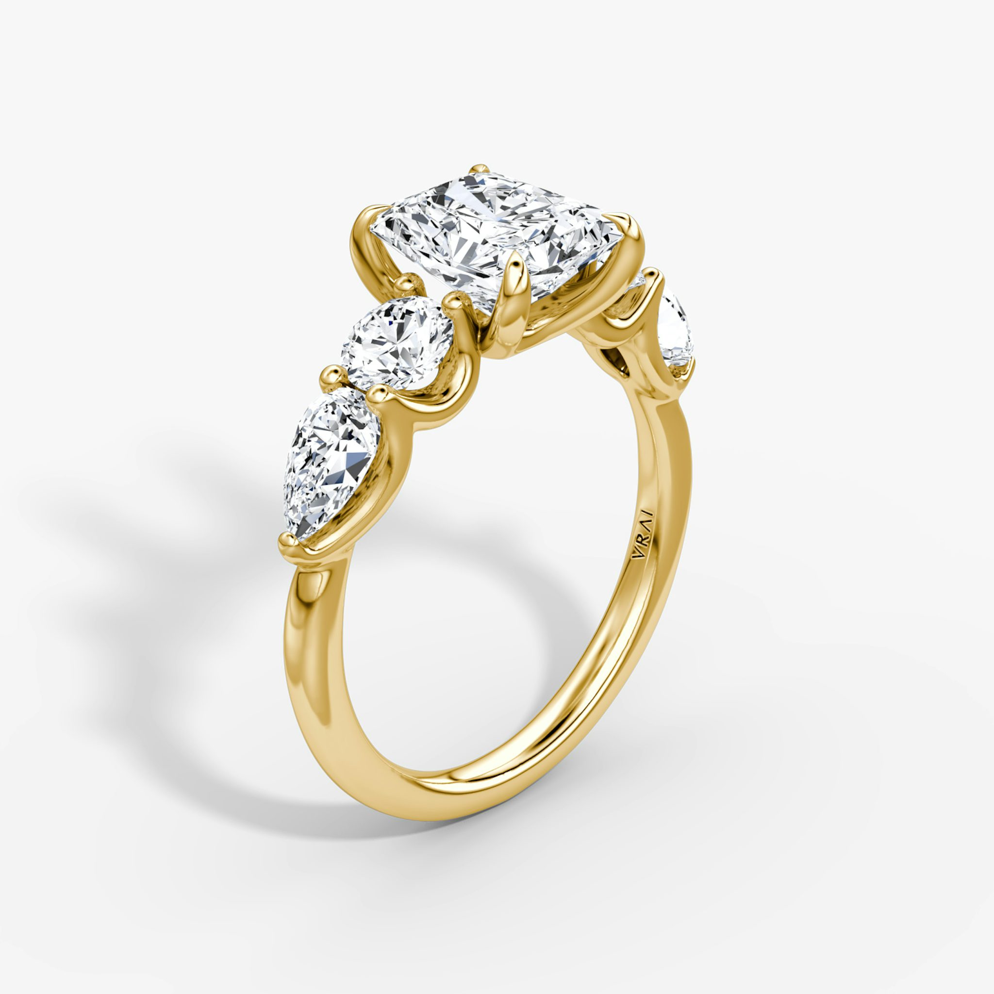 The Mixed Shape | Radiant | 18k | Yellow Gold | bandAccent: Plain | sideStoneOrientation: horizontal | sideStoneShape: Round Brilliant and Pear | diamondOrientation: vertical | caratWeight: other