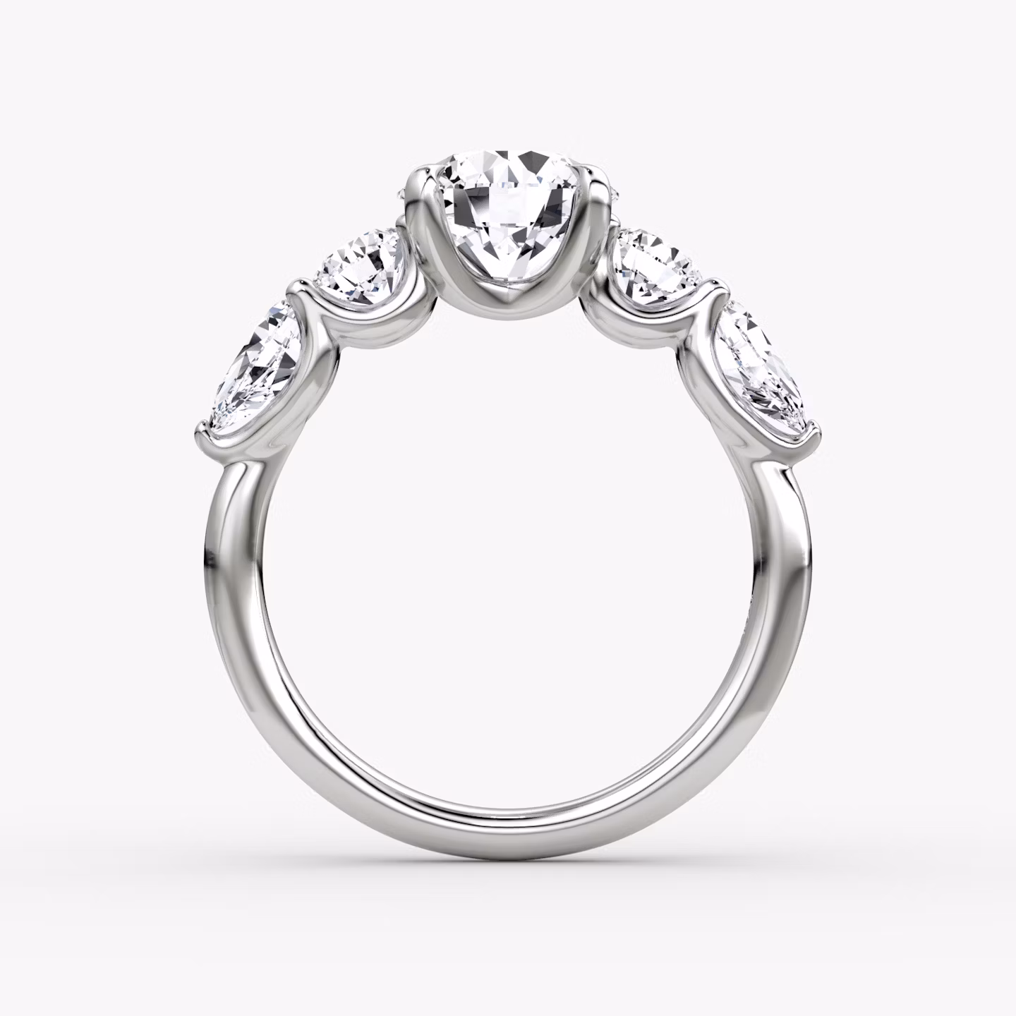 The Mixed Shape | Round Brilliant | 18k | White Gold | bandAccent: Plain | caratWeight: 1.0ct | sideStoneOrientation: horizontal | sideStoneShape: Round Brilliant and Pear | diamondOrientation: vertical