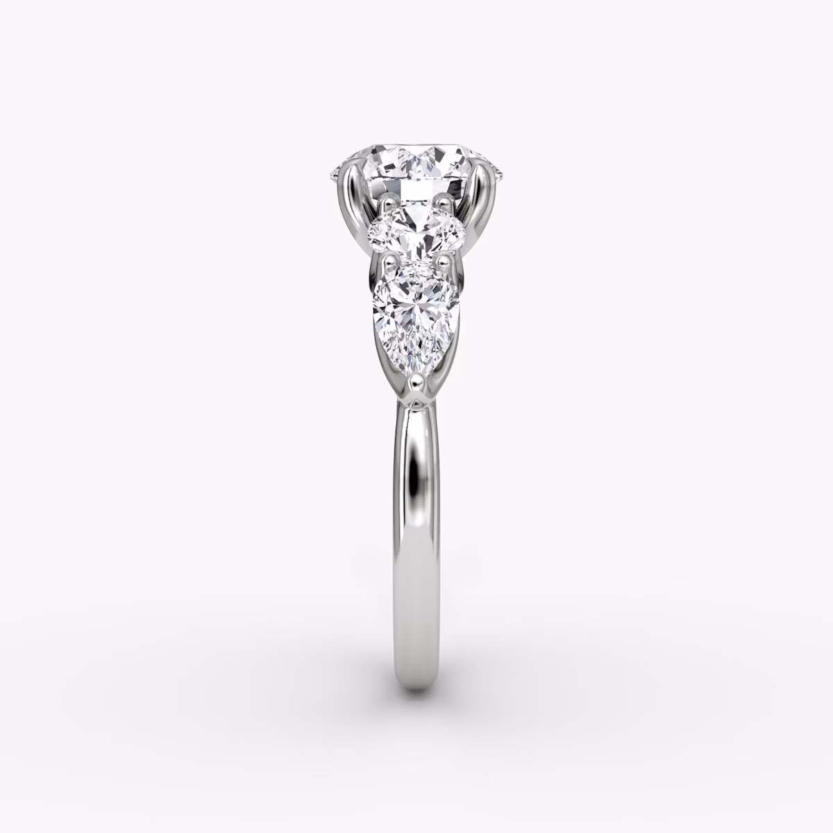 The Mixed Shape | Round Brilliant | 18k | White Gold | bandAccent: Plain | caratWeight: other | sideStoneOrientation: horizontal | sideStoneShape: Round Brilliant and Pear | diamondOrientation: vertical