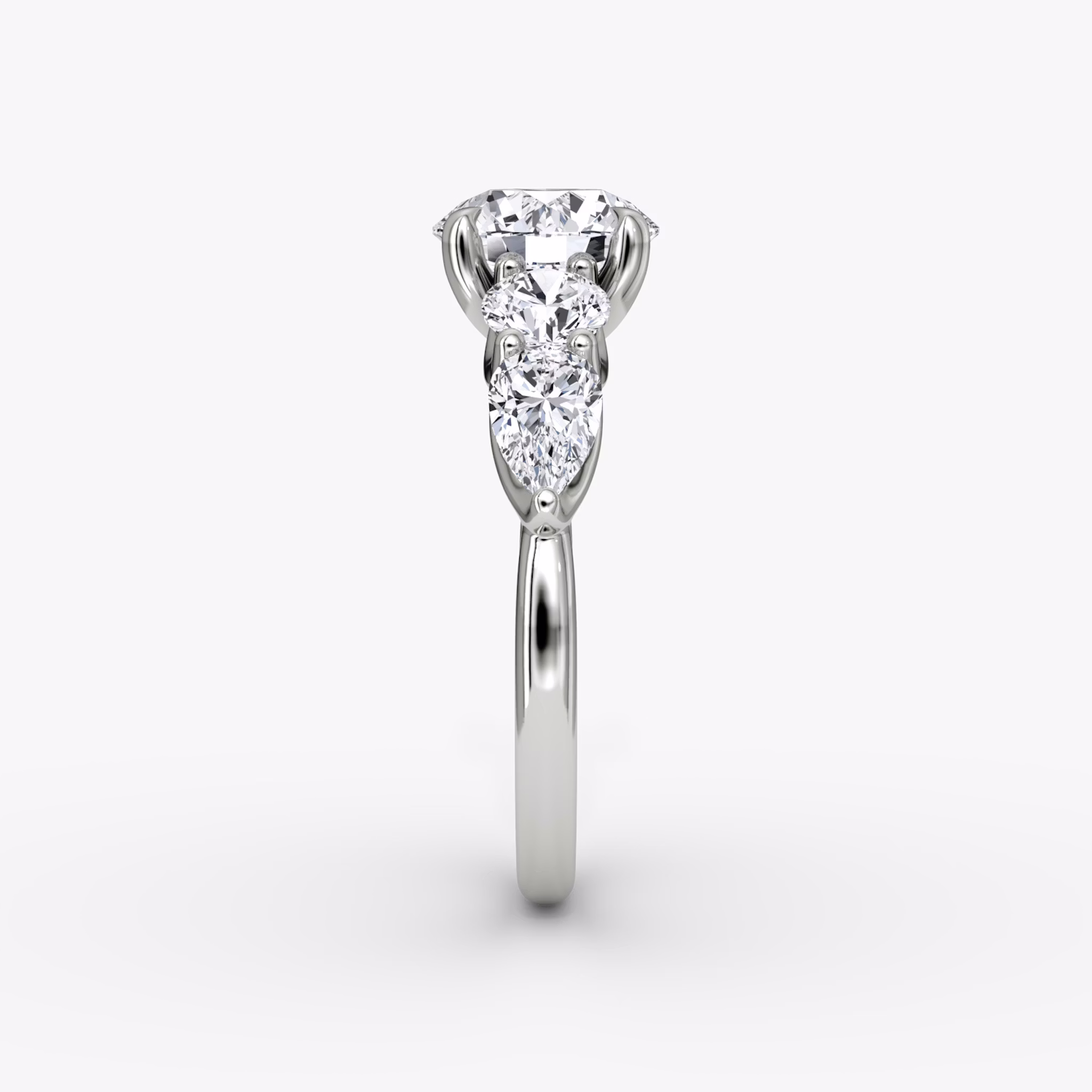 The Mixed Shape | Round Brilliant | Platinum | bandAccent: Plain | caratWeight: 1.0ct | sideStoneOrientation: horizontal | sideStoneShape: Round Brilliant and Pear | diamondOrientation: vertical