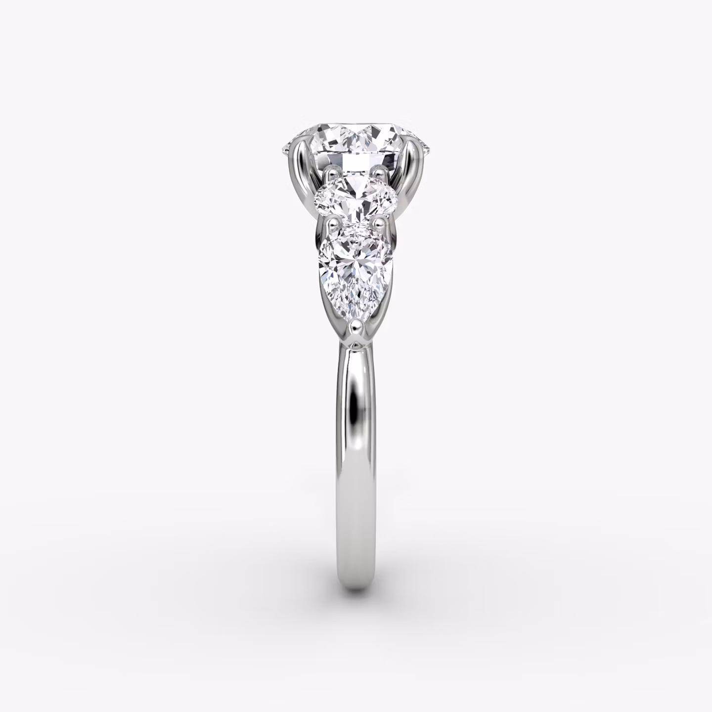 The Mixed Shape | Round Brilliant | 18k | White Gold | bandAccent: Plain | caratWeight: 1.0ct | sideStoneOrientation: horizontal | sideStoneShape: Round Brilliant and Pear | diamondOrientation: vertical