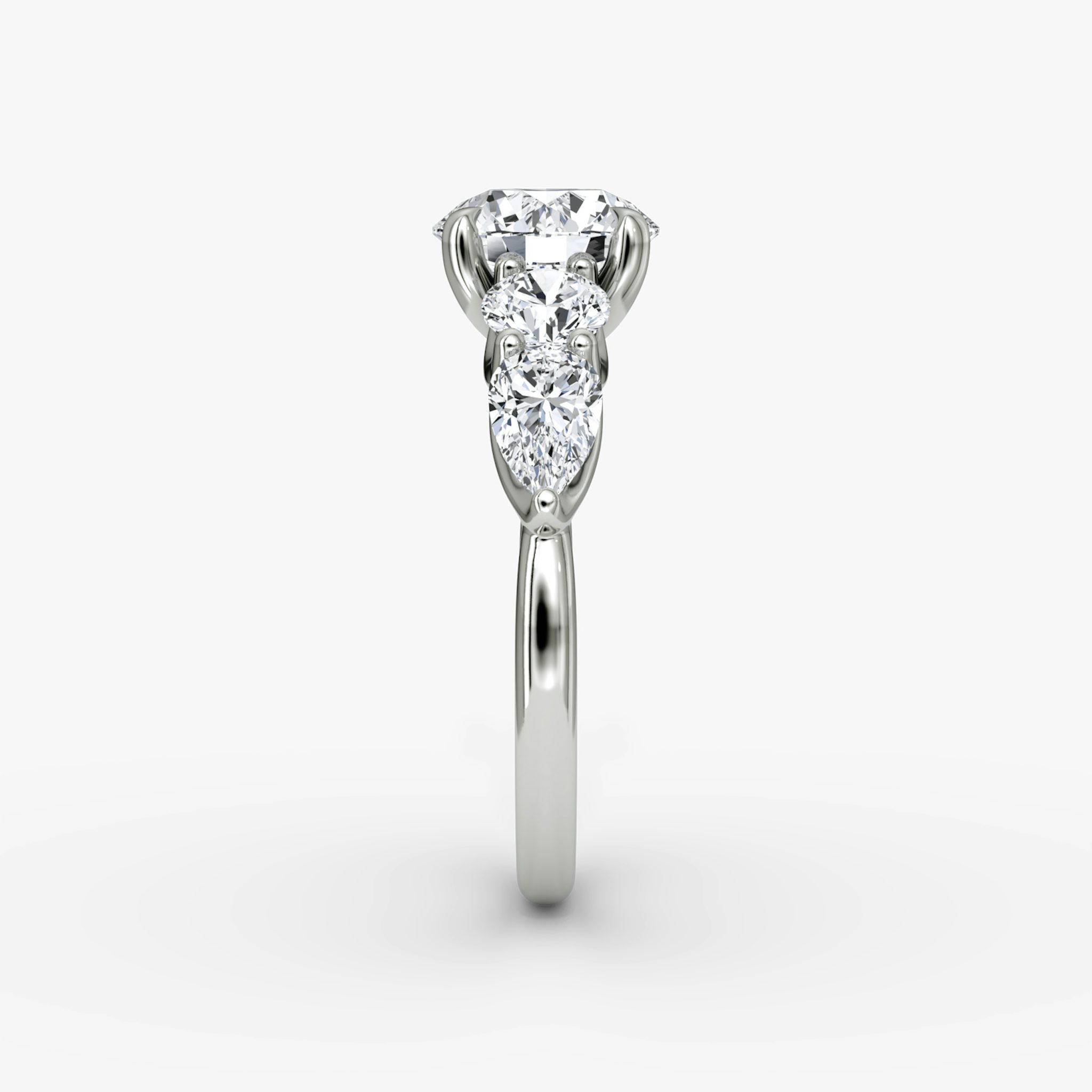The Mixed Shape | Round Brilliant | Platinum | bandAccent: Plain | caratWeight: 1.0ct | sideStoneOrientation: horizontal | sideStoneShape: Round Brilliant and Pear | diamondOrientation: vertical