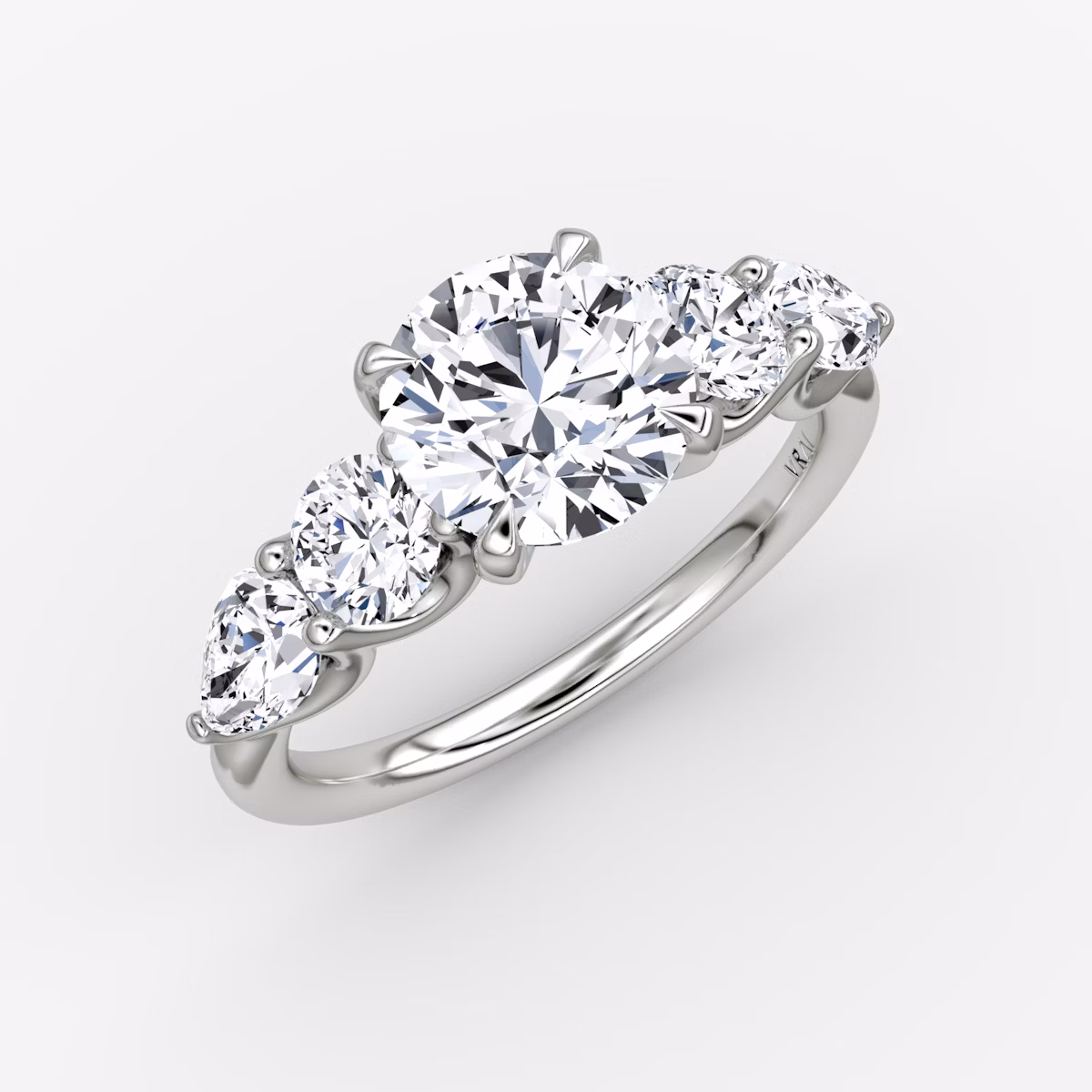 The Mixed Shape | Round Brilliant | 18k | White Gold | bandAccent: Plain | caratWeight: other | sideStoneOrientation: horizontal | sideStoneShape: Round Brilliant and Pear | diamondOrientation: vertical
