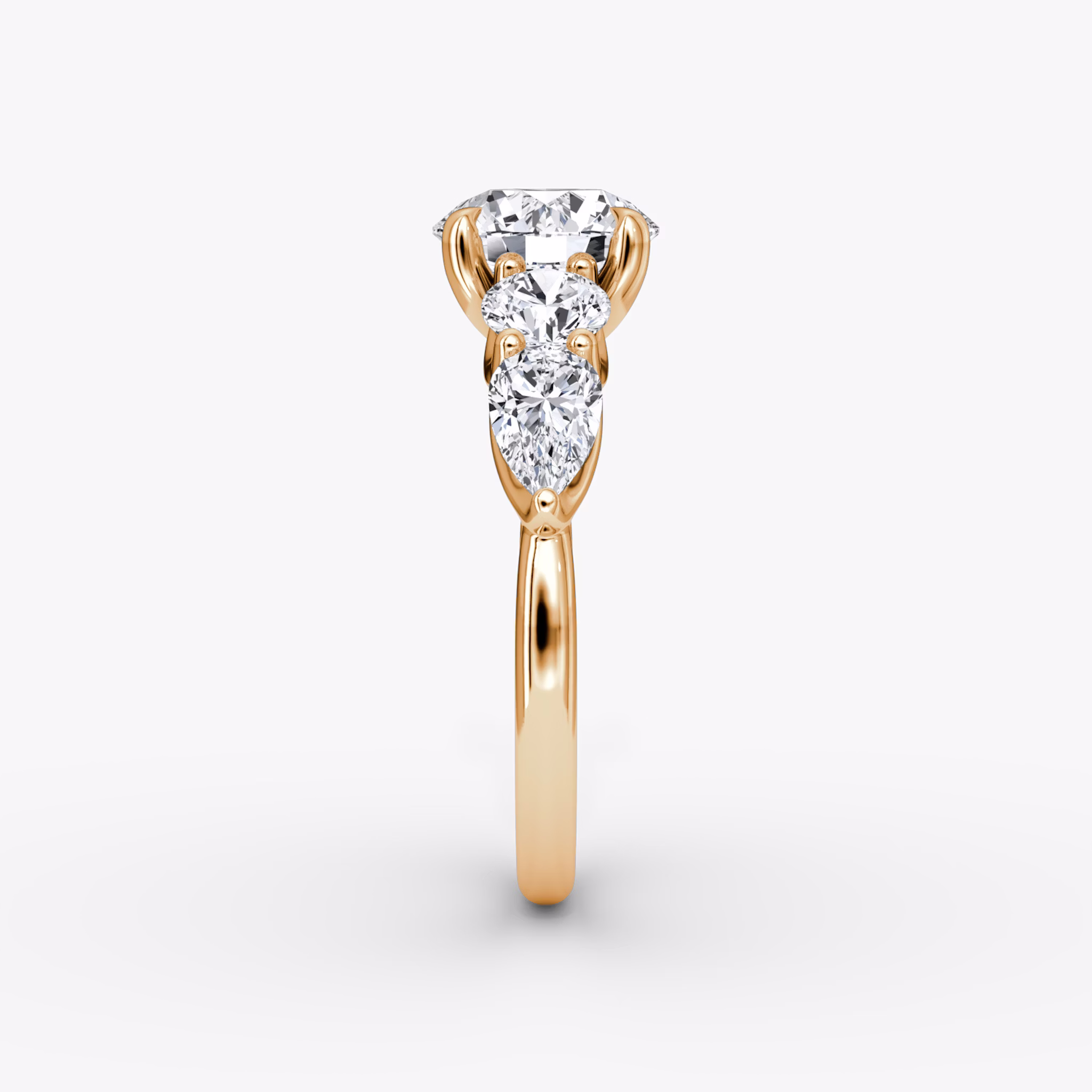 The Mixed Shape | Round Brilliant | 14k | Rose Gold | bandAccent: Plain | caratWeight: other | sideStoneOrientation: horizontal | sideStoneShape: Round Brilliant and Pear | diamondOrientation: vertical