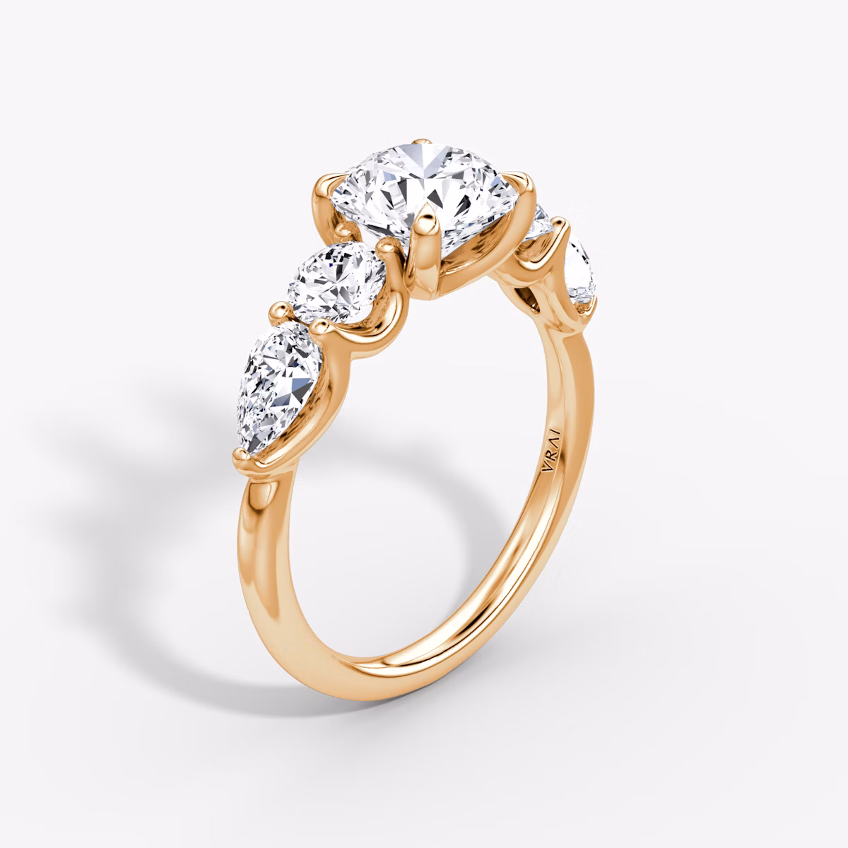 The Mixed Shape | Round Brilliant | 14k | Rose Gold | bandAccent: Plain | caratWeight: 1.0ct | sideStoneOrientation: horizontal | sideStoneShape: Round Brilliant and Pear | diamondOrientation: vertical