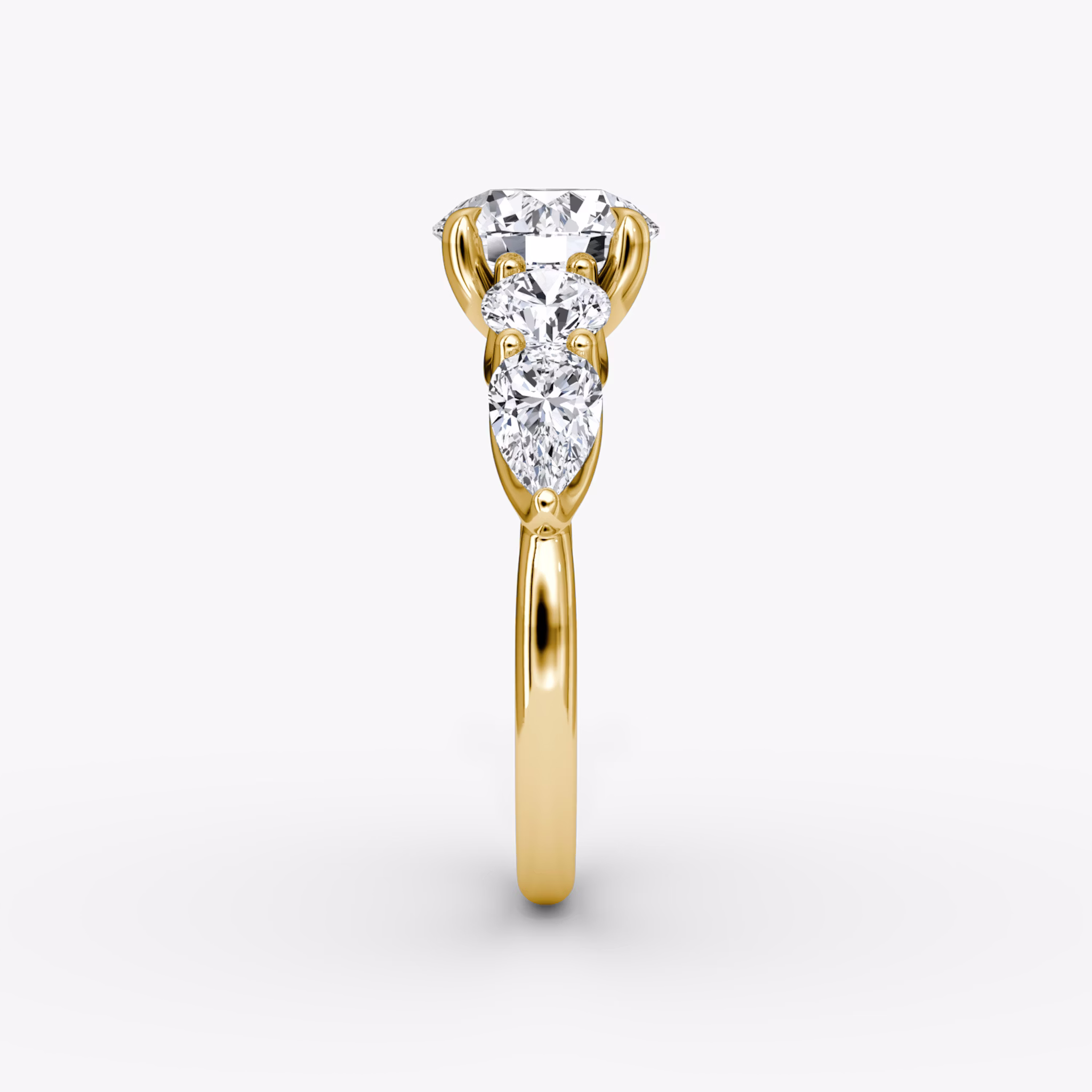 The Mixed Shape | Round Brilliant | 18k | Yellow Gold | bandAccent: Plain | caratWeight: other | sideStoneOrientation: horizontal | sideStoneShape: Round Brilliant and Pear | diamondOrientation: vertical