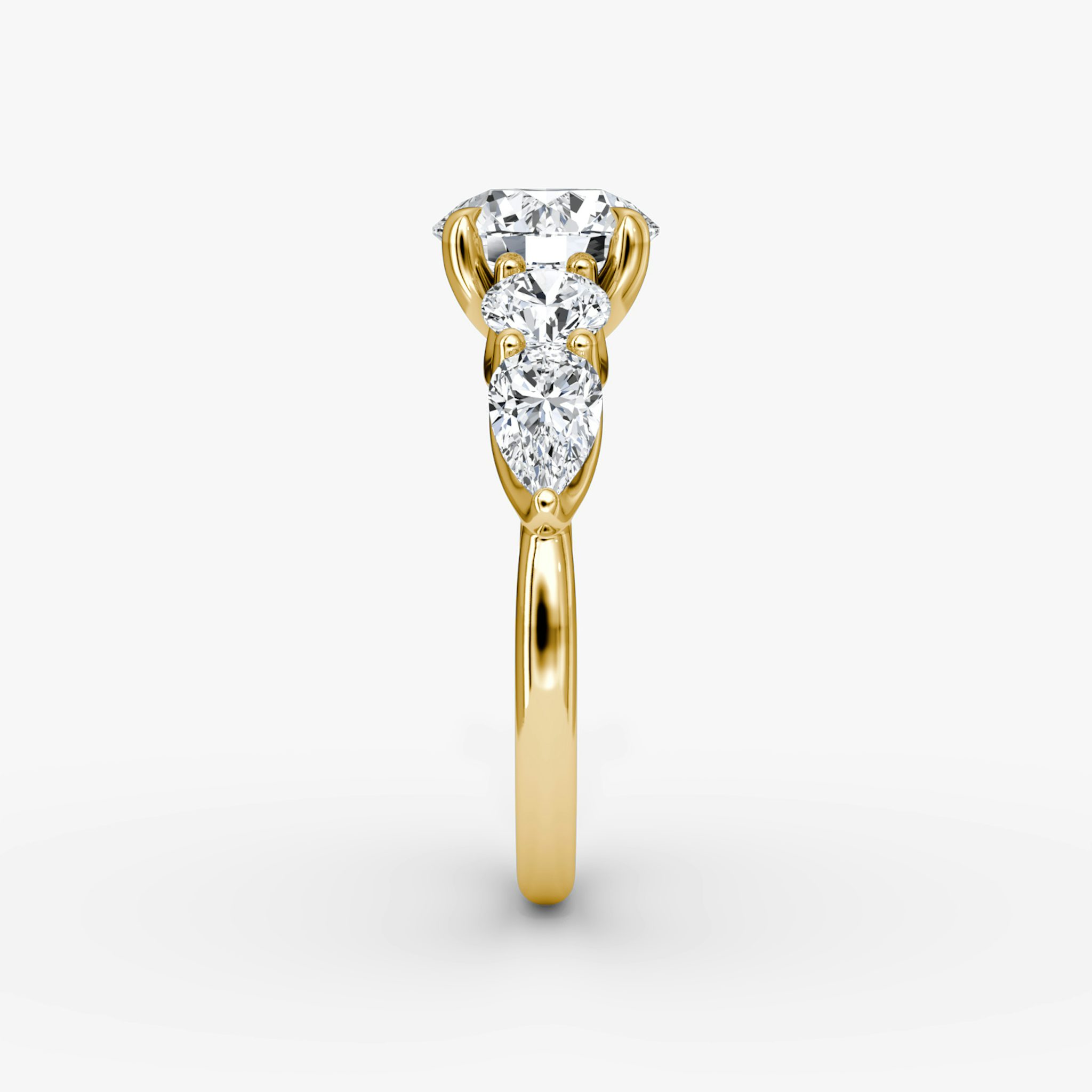 The Mixed Shape | Round Brilliant | 18k | Yellow Gold | bandAccent: Plain | caratWeight: other | sideStoneOrientation: horizontal | sideStoneShape: Round Brilliant and Pear | diamondOrientation: vertical