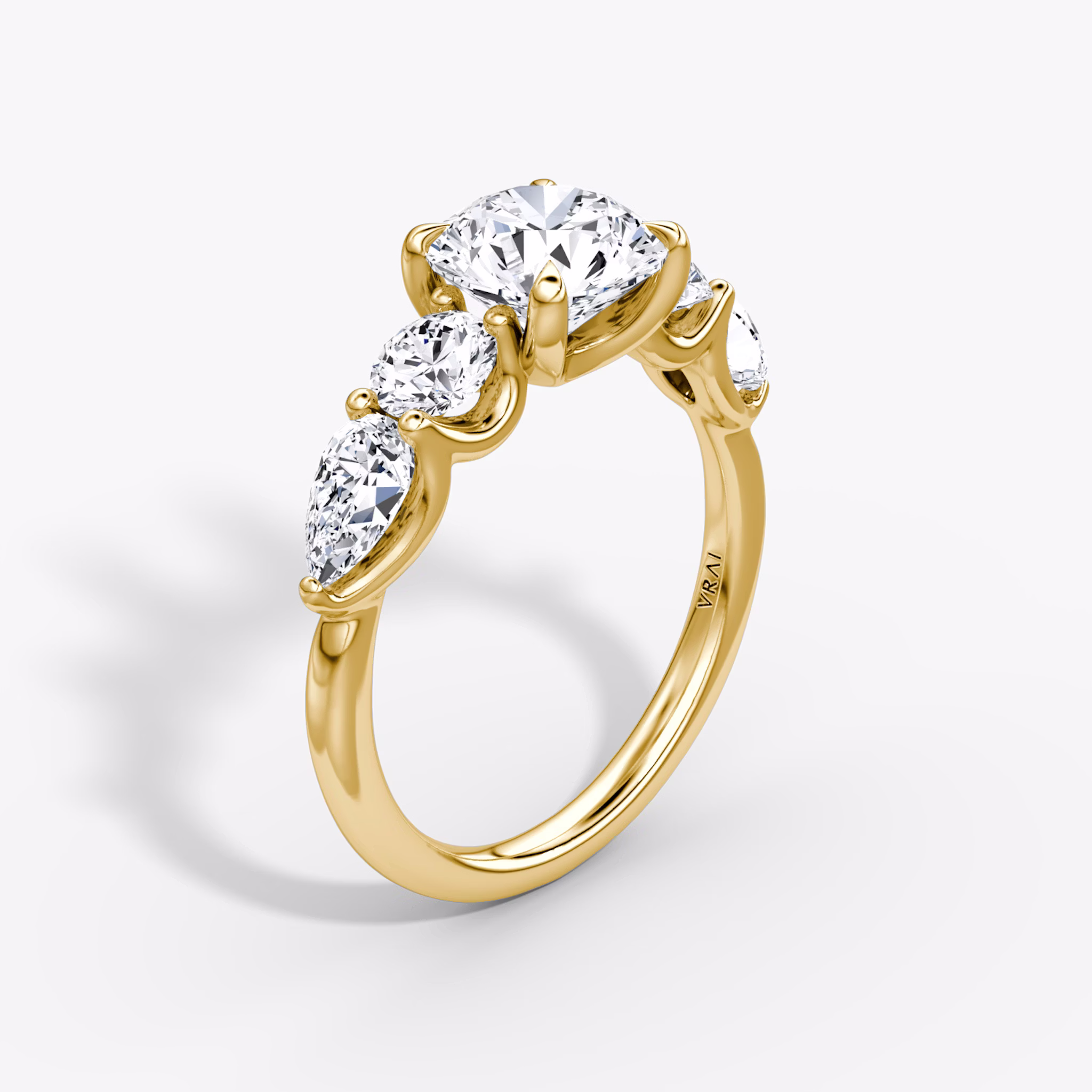 The Mixed Shape | Round Brilliant | 18k | Yellow Gold | bandAccent: Plain | caratWeight: other | sideStoneOrientation: horizontal | sideStoneShape: Round Brilliant and Pear | diamondOrientation: vertical