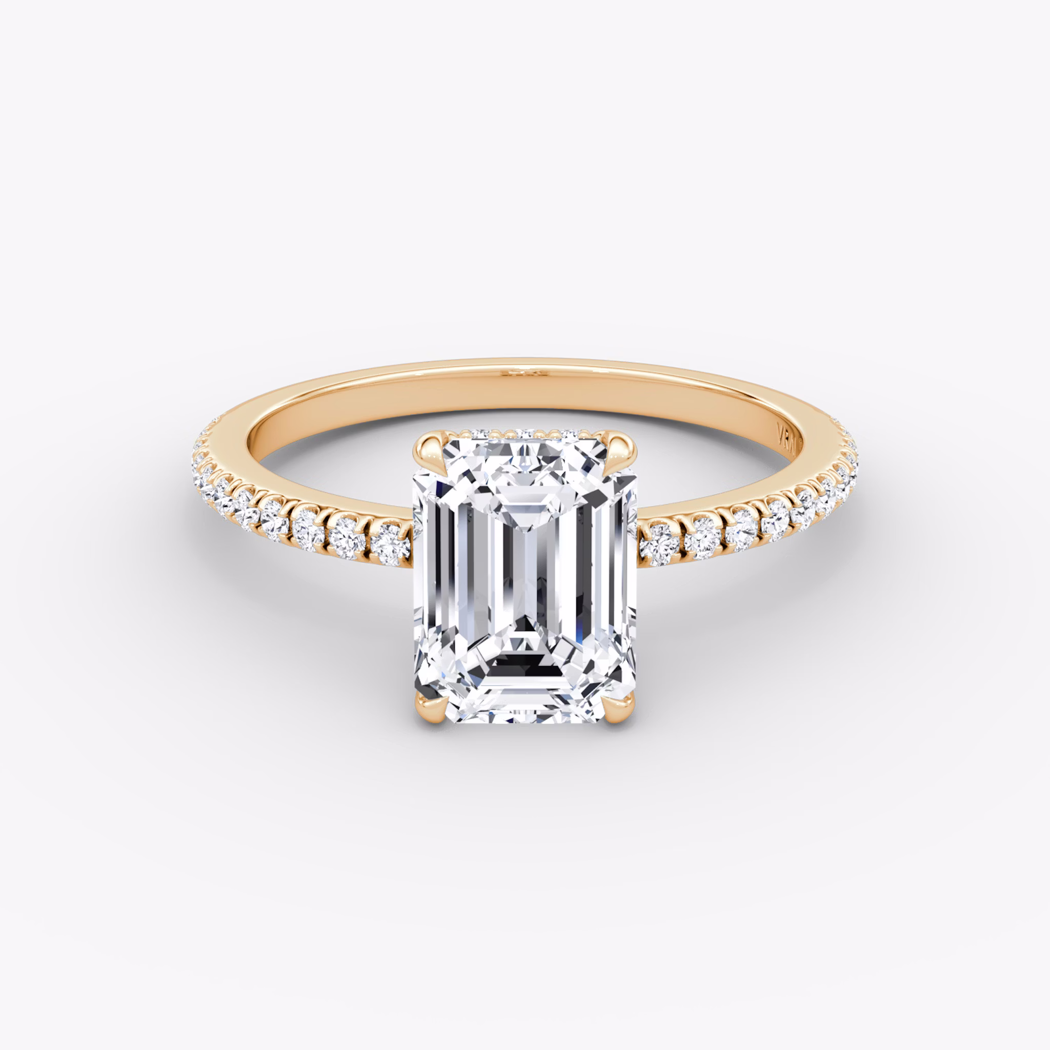 Emerald-cut diamond ring with hidden halo and pavé band in rose gold, VRAI Signature Hidden Halo setting.