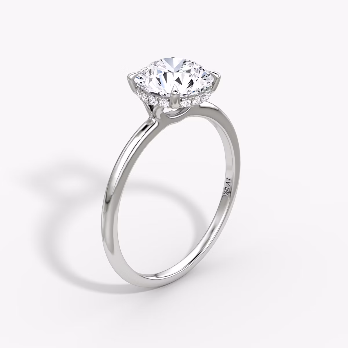The Signature | Round Brilliant | 18k | White Gold | bandAccent: Plain | bandWidth: standard | caratWeight: 1.5ct | hiddenHalo: yes | diamondOrientation: vertical