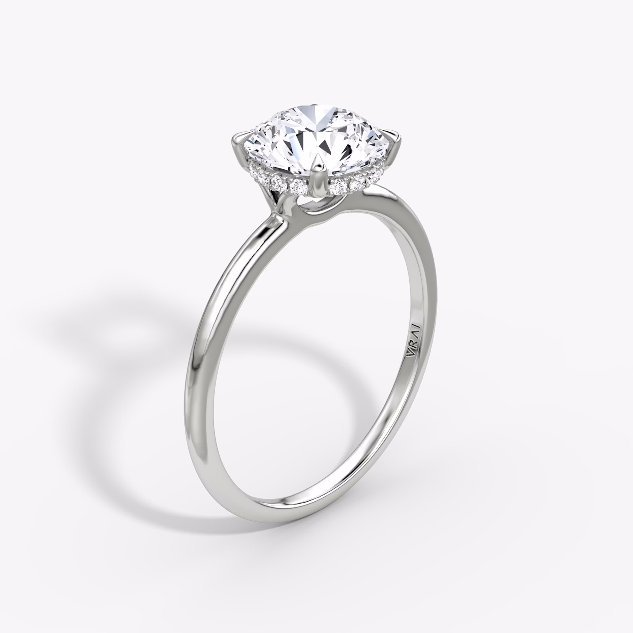 The Signature | Round Brilliant | Platinum | bandAccent: Plain | bandWidth: standard | caratWeight: 1.0ct | hiddenHalo: yes | diamondOrientation: vertical