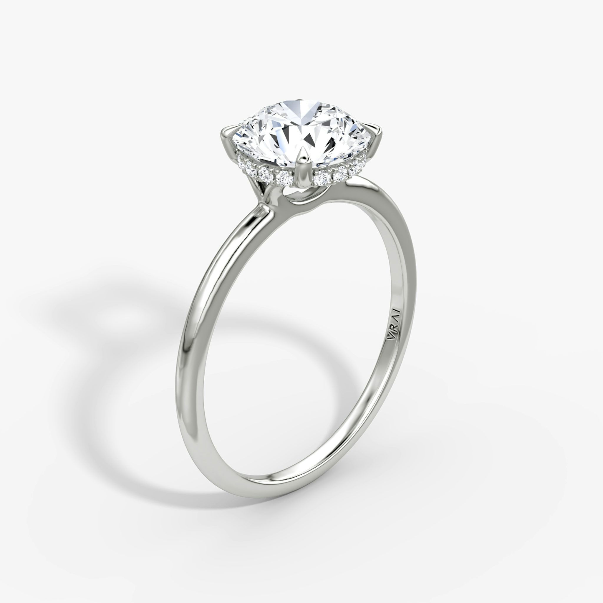 The Signature | Round Brilliant | Platinum | bandAccent: Plain | bandWidth: standard | caratWeight: 1.0ct | hiddenHalo: yes | diamondOrientation: vertical