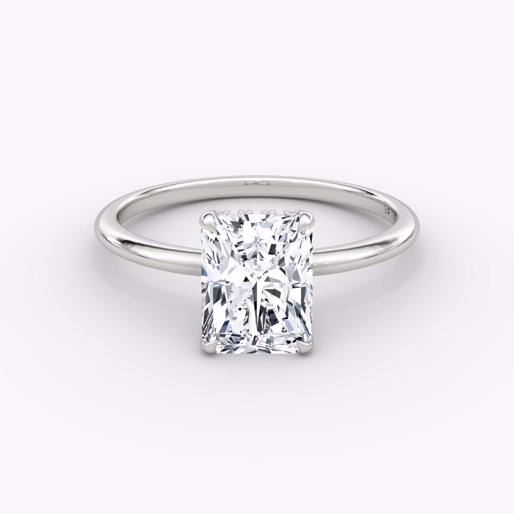 Radiant-cut diamond ring with hidden halo and plain platinum band, VRAI Signature Hidden Halo setting.