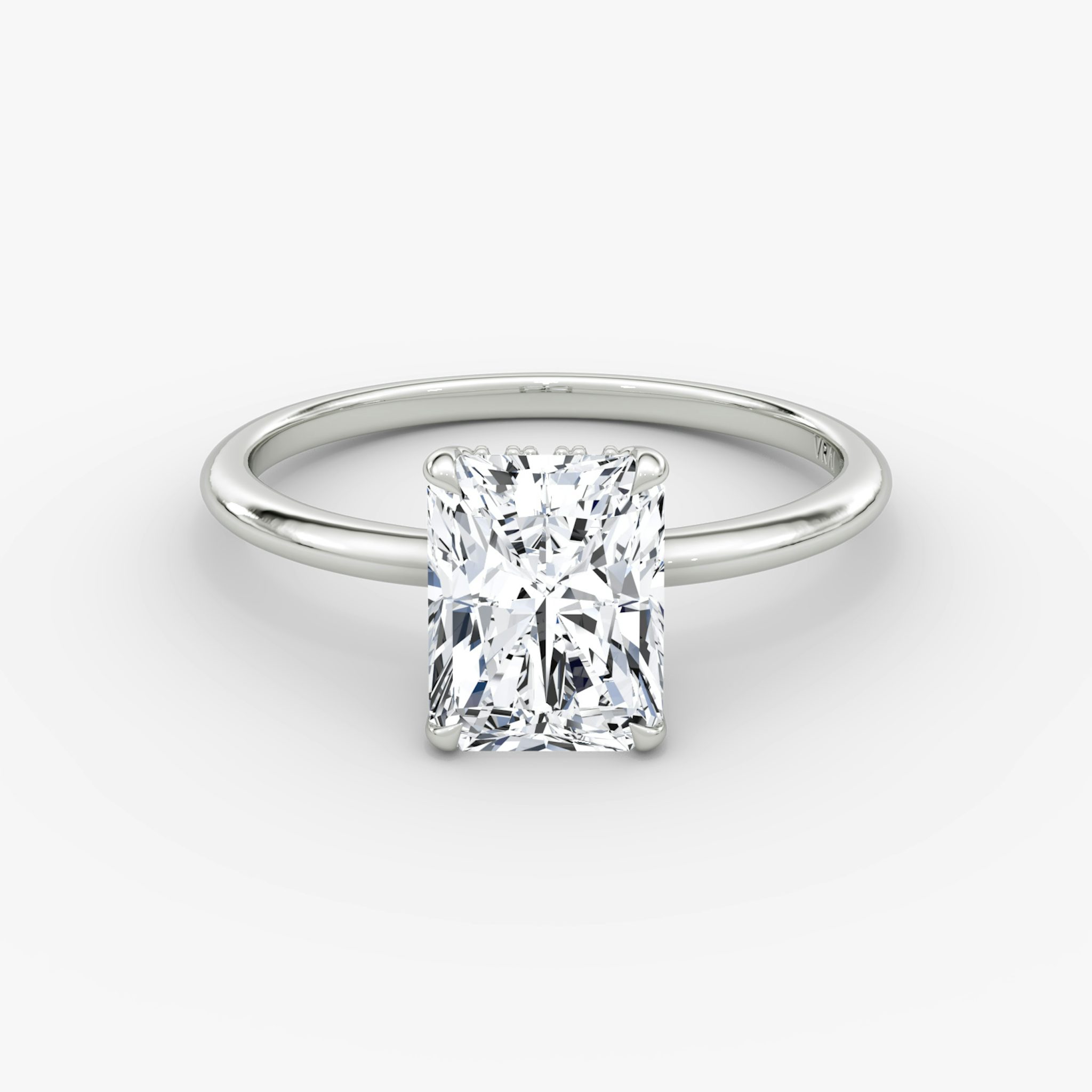 Radiant-cut diamond ring with hidden halo and plain platinum band, VRAI Signature Hidden Halo setting.