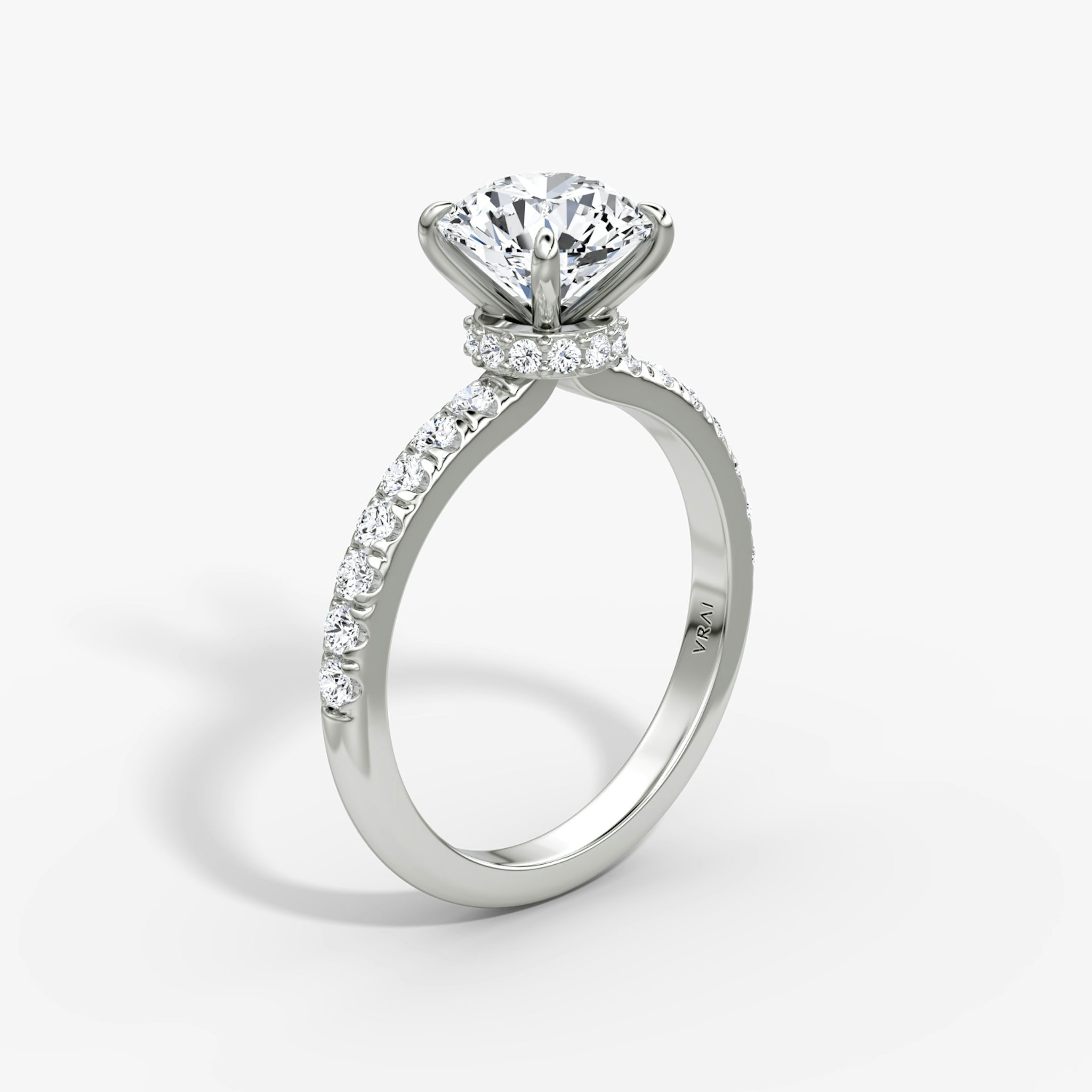The Veiled Halo | Round Brilliant | Platinum | bandAccent: Pavé | caratWeight: 1.5ct | diamondOrientation: vertical