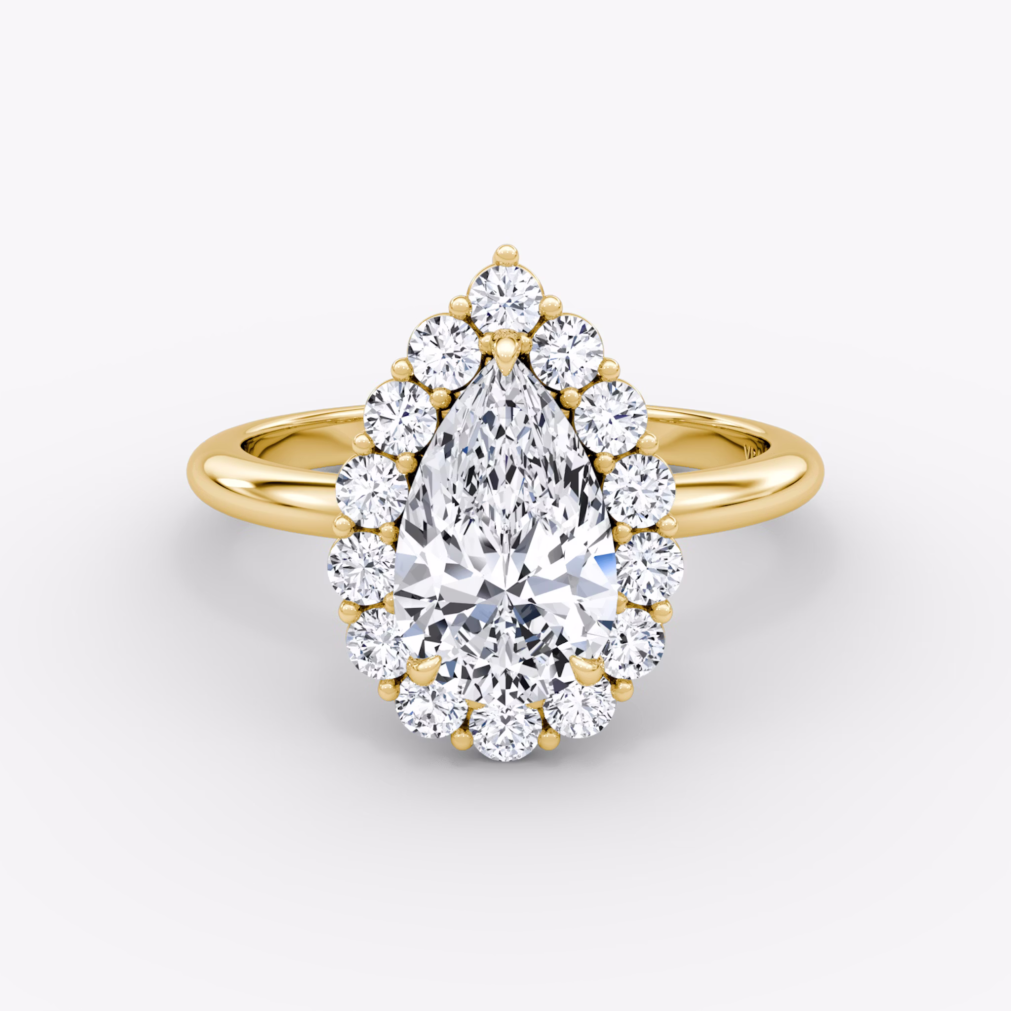 Front view of the signature floral halo pear yellow gold engagement ring