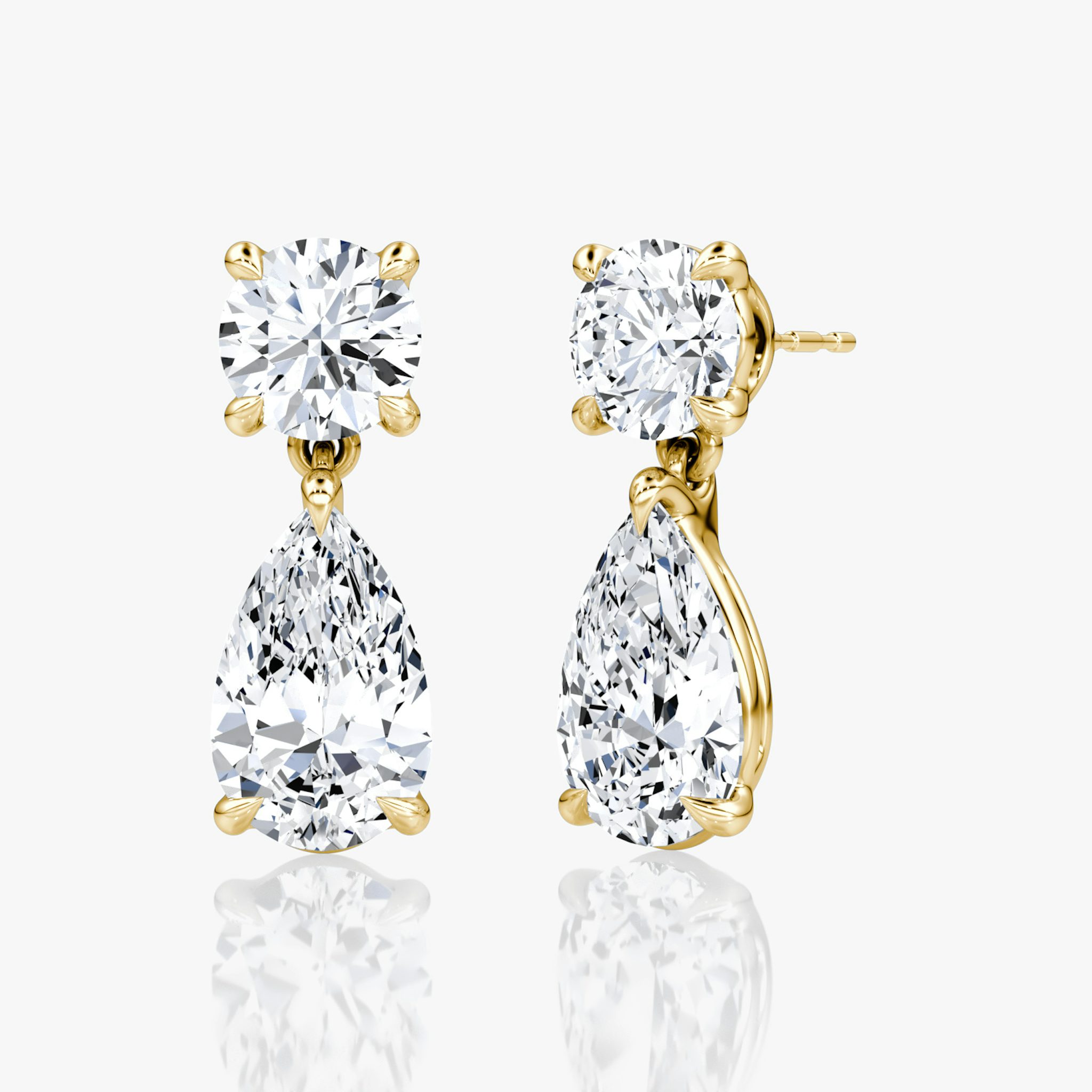 A pair of gold Duo Pear Drop Earrings.