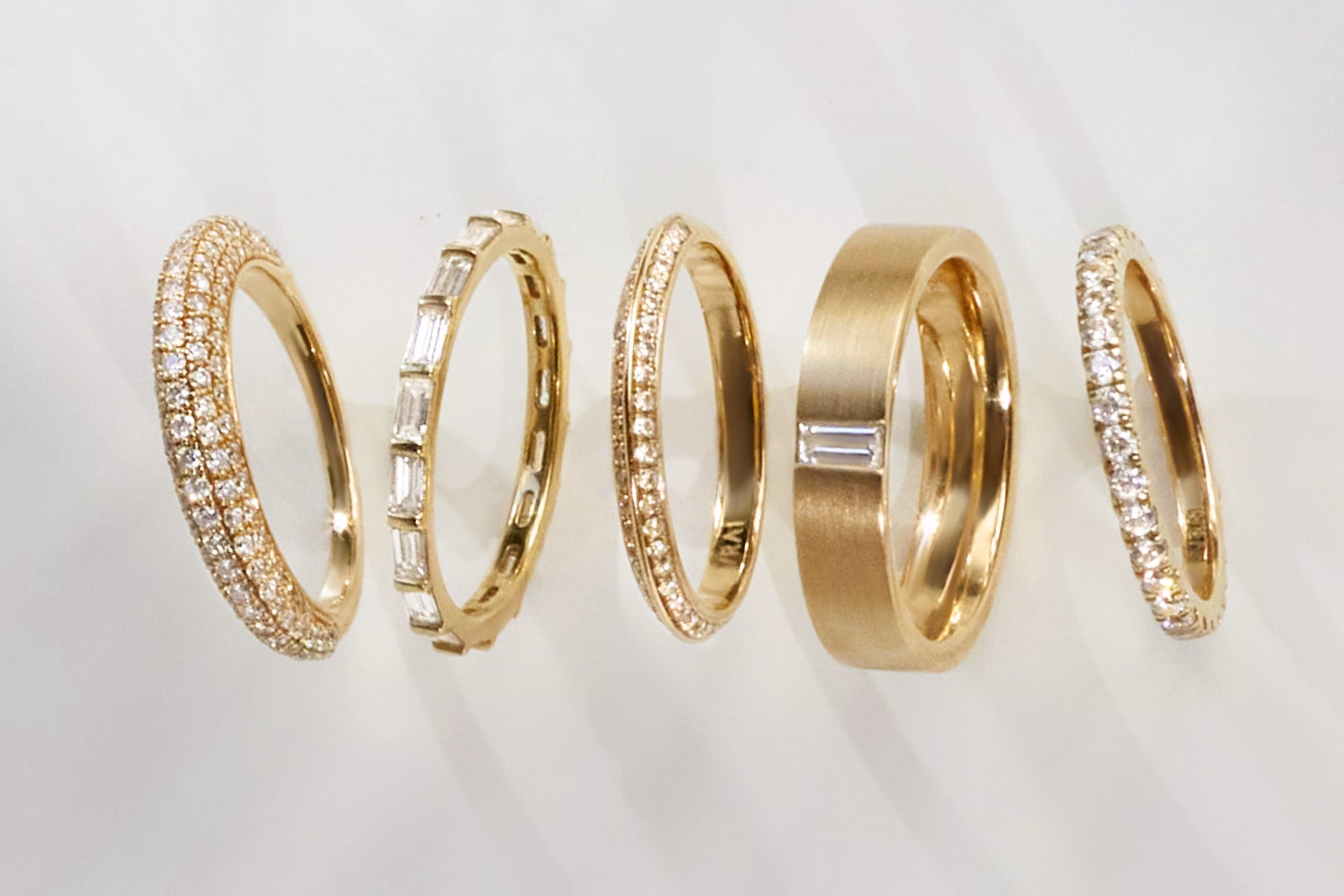 Five different types of rings including pave ring, signet ring and more