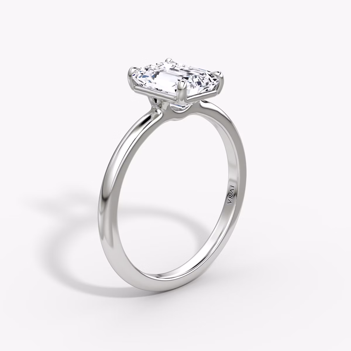 The Signature | Emerald | Platinum | bandAccent: Plain | bandWidth: standard | hiddenHalo: no | diamondOrientation: vertical | caratWeight: other