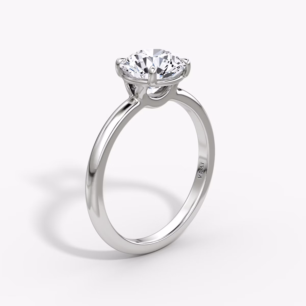 The Signature | Round Brilliant | Platinum | bandAccent: Plain | bandWidth: standard | caratWeight: 1.0ct | hiddenHalo: no | diamondOrientation: vertical