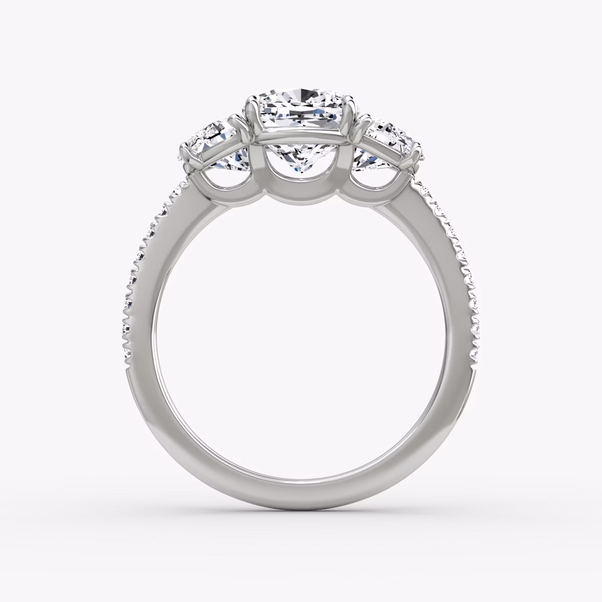 The Three Stone | Cushion | Platinum | bandAccent: Pavé | sideStoneCarat: 0.50ct | sideStoneShape: Half Moon | diamondOrientation: vertical | caratWeight: other