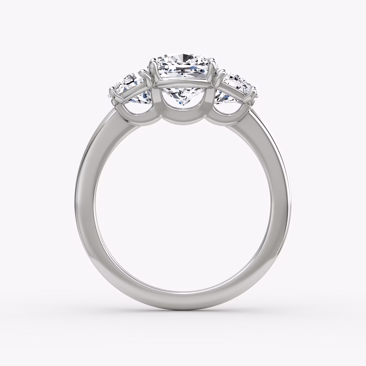 The Three Stone | Cushion | Platinum | bandAccent: Plain | sideStoneCarat: 0.50ct | sideStoneShape: Half Moon | diamondOrientation: vertical | caratWeight: other
