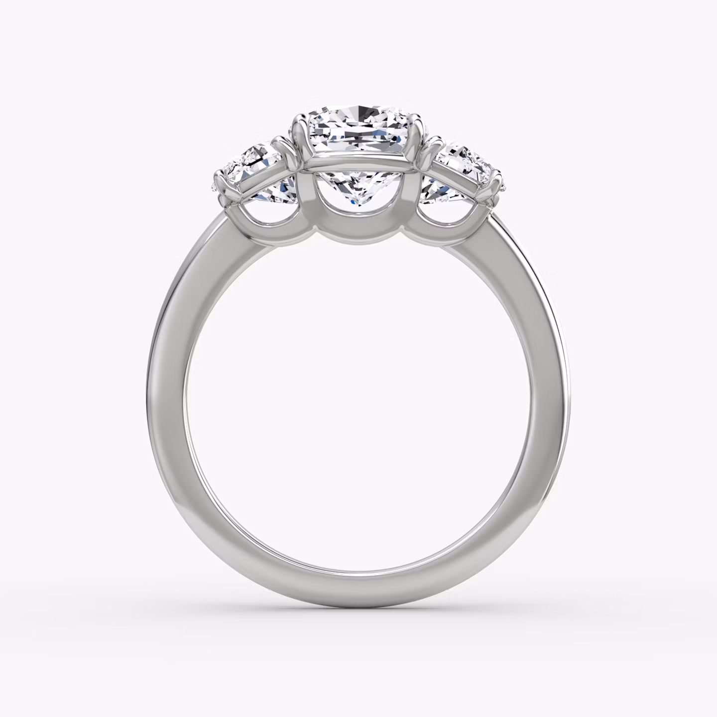 The Three Stone | Cushion | Platinum | bandAccent: Plain | sideStoneCarat: 0.50ct | sideStoneShape: Half Moon | diamondOrientation: vertical | caratWeight: other