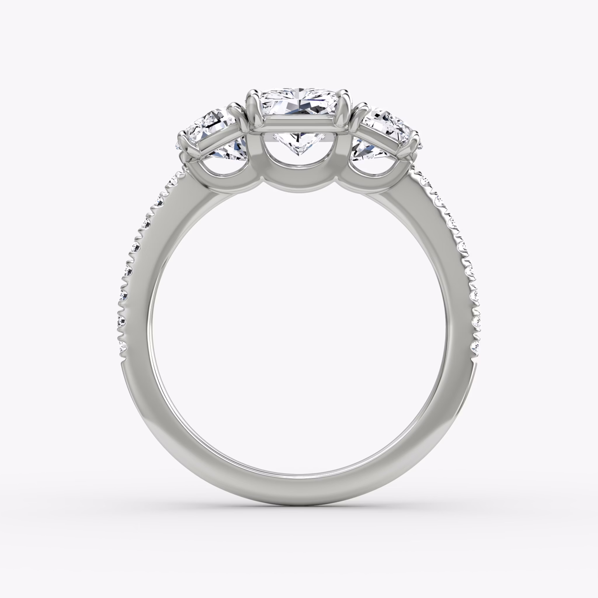 The Three Stone | Radiant | 18k | White Gold | bandAccent: Pavé | sideStoneCarat: 0.50ct | sideStoneShape: Half Moon | diamondOrientation: vertical | caratWeight: other