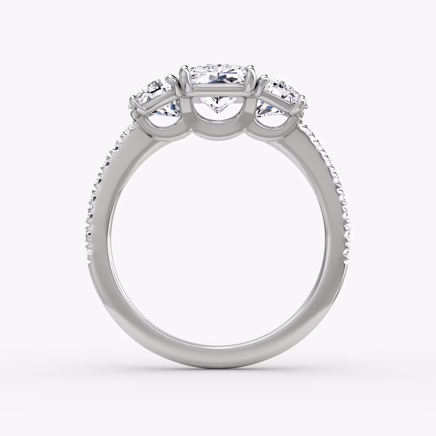 The Three Stone | Radiant | 18k | White Gold | bandAccent: Pavé | sideStoneCarat: 0.50ct | sideStoneShape: Half Moon | diamondOrientation: vertical | caratWeight: other