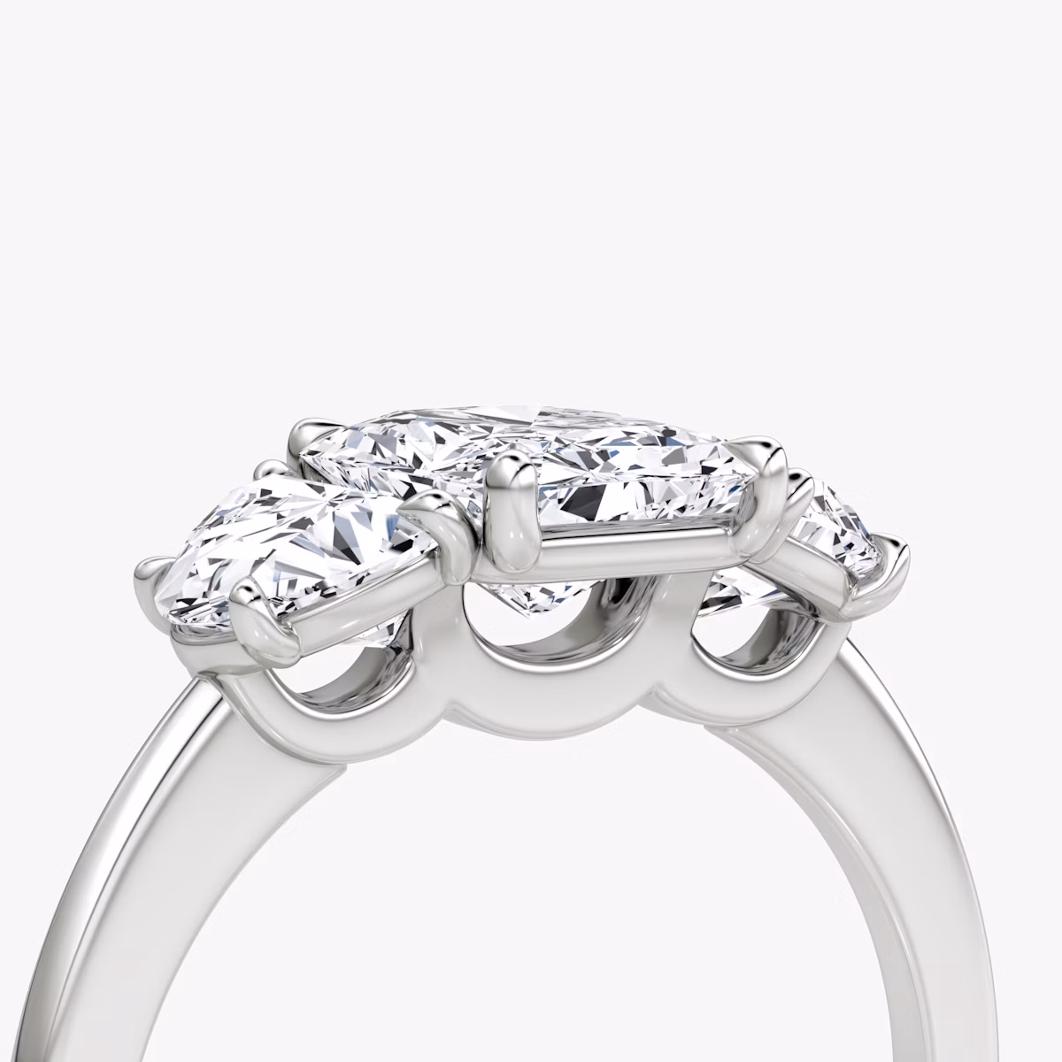 The Three Stone | Radiant | Platinum | bandAccent: Plain | sideStoneCarat: 0.50ct | sideStoneShape: Half Moon | diamondOrientation: vertical | caratWeight: other
