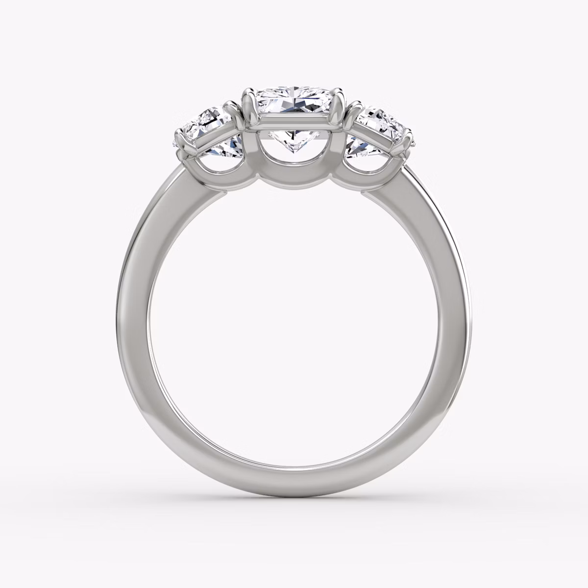 The Three Stone | Radiant | Platinum | bandAccent: Plain | sideStoneCarat: 0.50ct | sideStoneShape: Half Moon | diamondOrientation: vertical | caratWeight: other