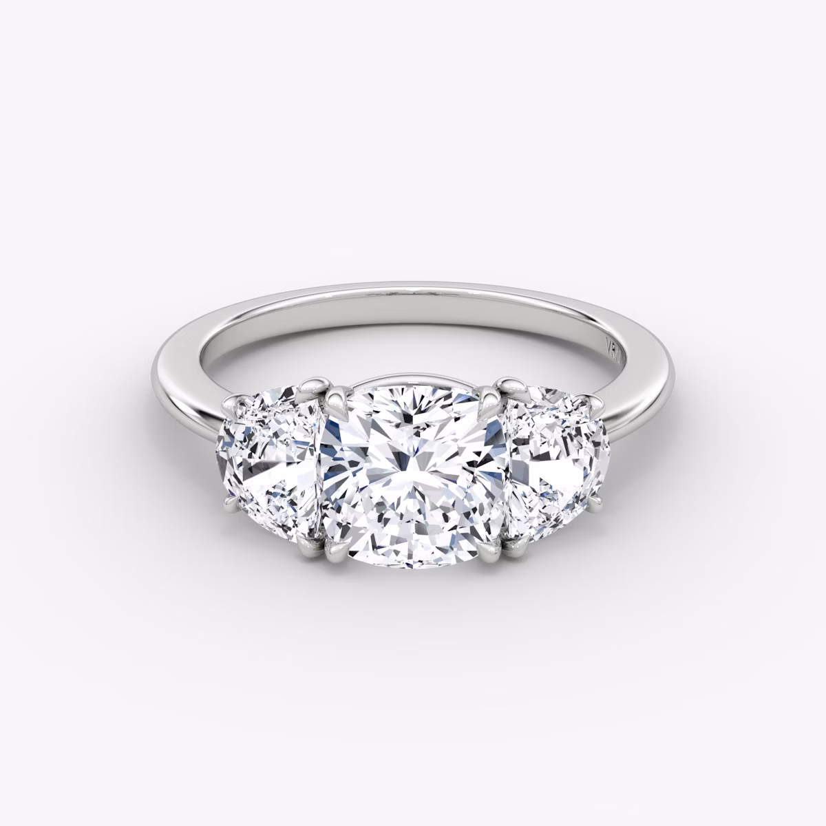 The Three Stone | Cushion | Platinum | bandAccent: Plain | sideStoneCarat: 0.50ct | sideStoneShape: Half Moon | diamondOrientation: vertical | caratWeight: other