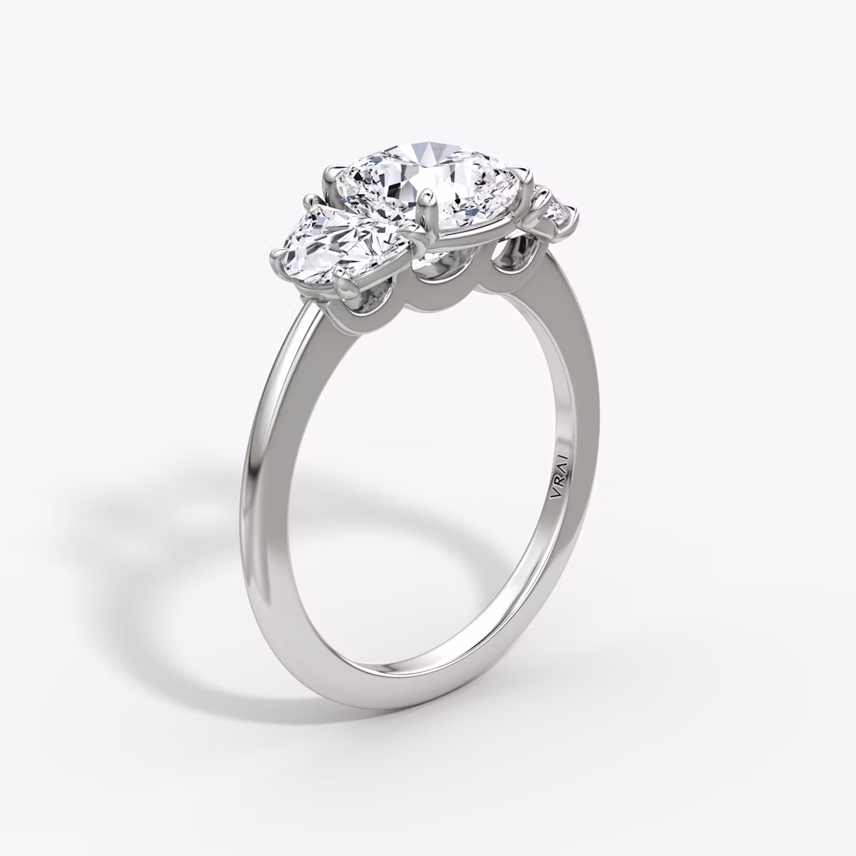The Three Stone | Cushion | Platinum | bandAccent: Plain | sideStoneCarat: 0.50ct | sideStoneShape: Half Moon | diamondOrientation: vertical | caratWeight: other